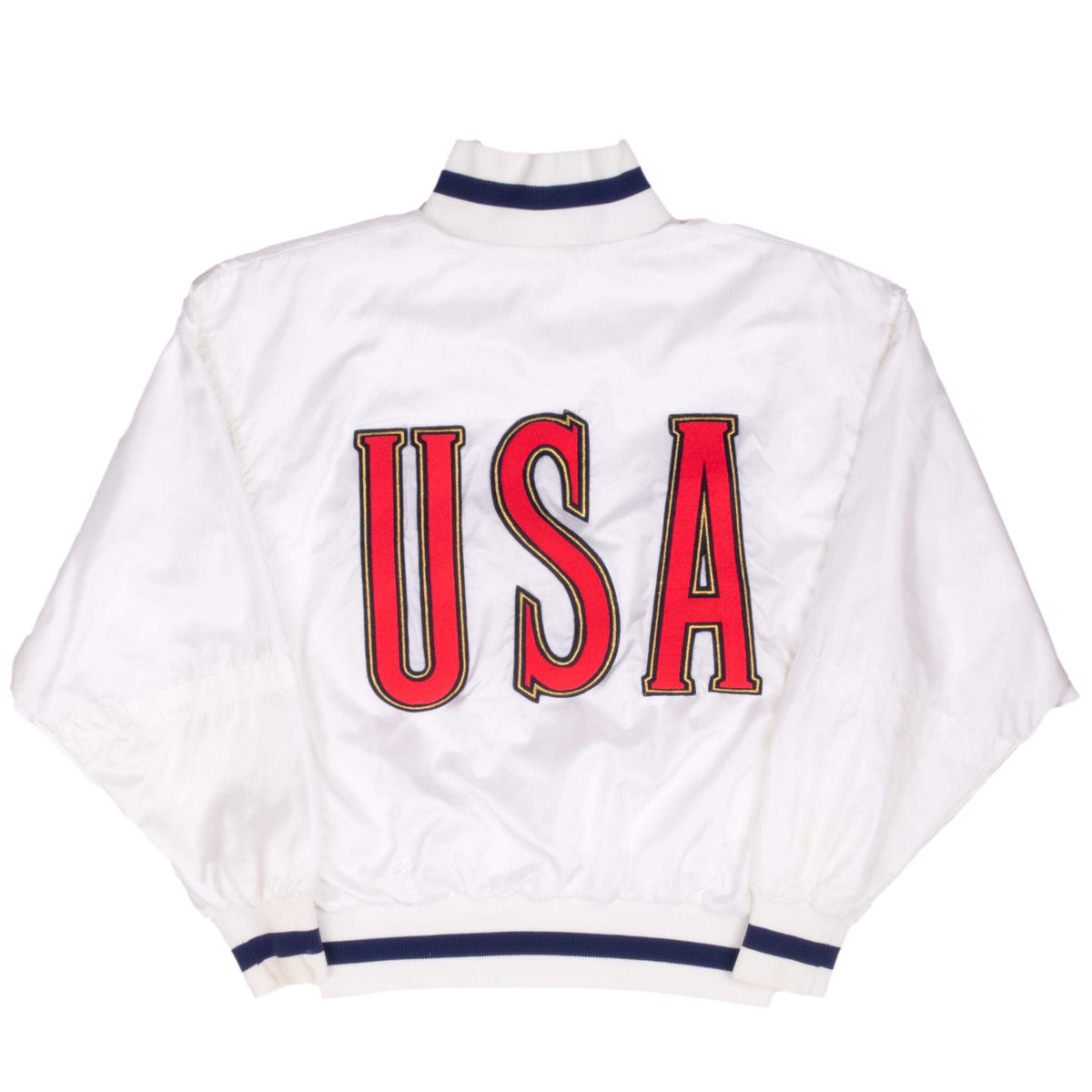 Back of white Nike track jacket with large red USA lettering and navy striped trim