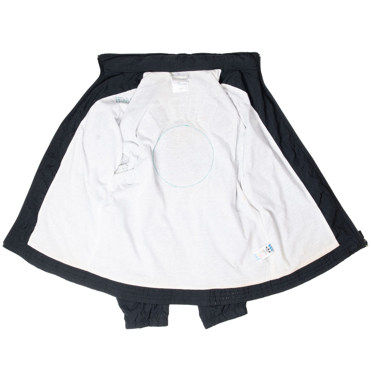 Open Adidas windbreaker showing white interior lining and black outer shell