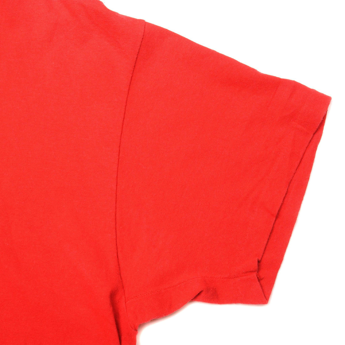 Close-up of red T-shirt sleeve and stitching