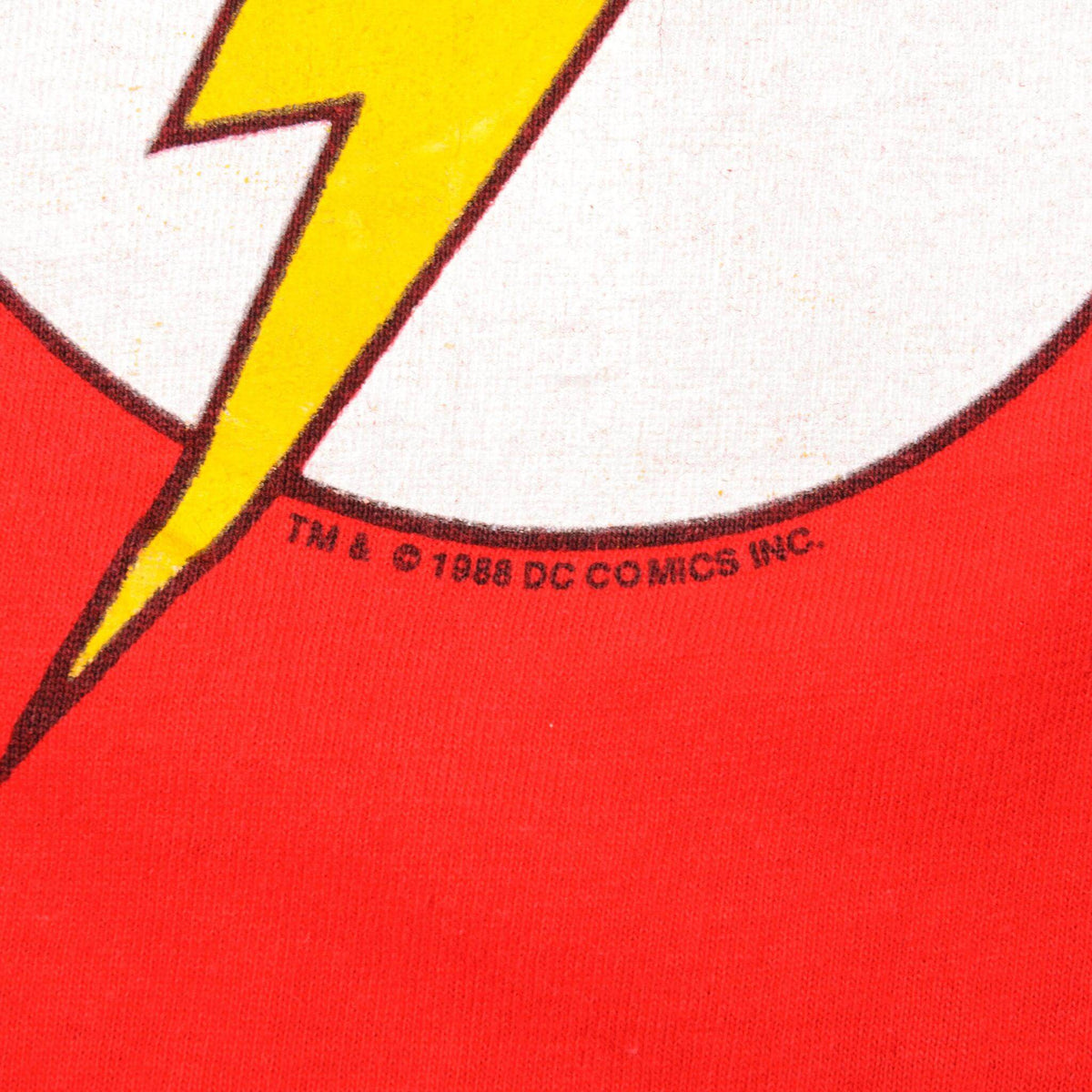Close-up of 1988 DC Comics copyright beneath The Flash logo print