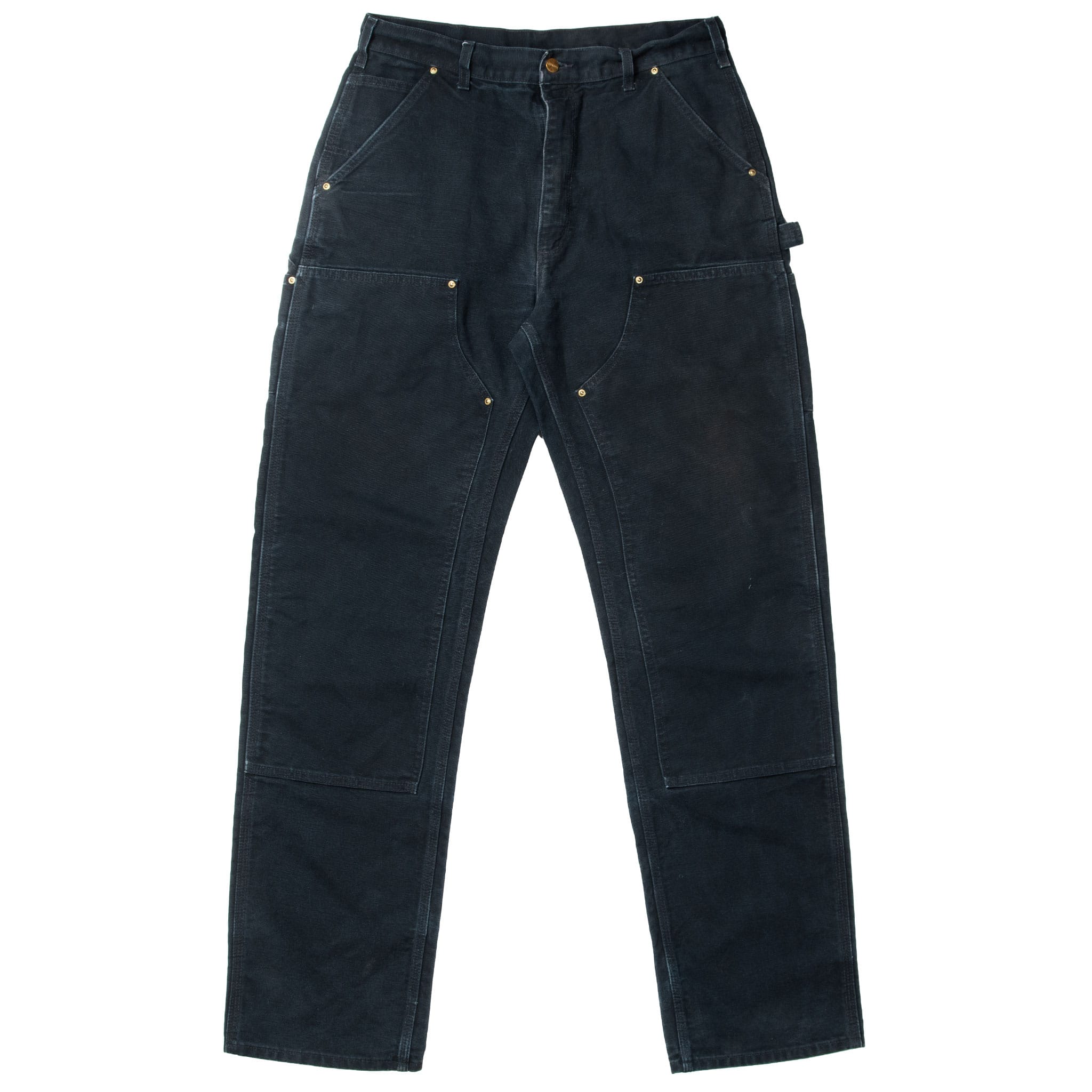 Front of black Carhartt carpenter pants with riveted pockets and double-knee panels