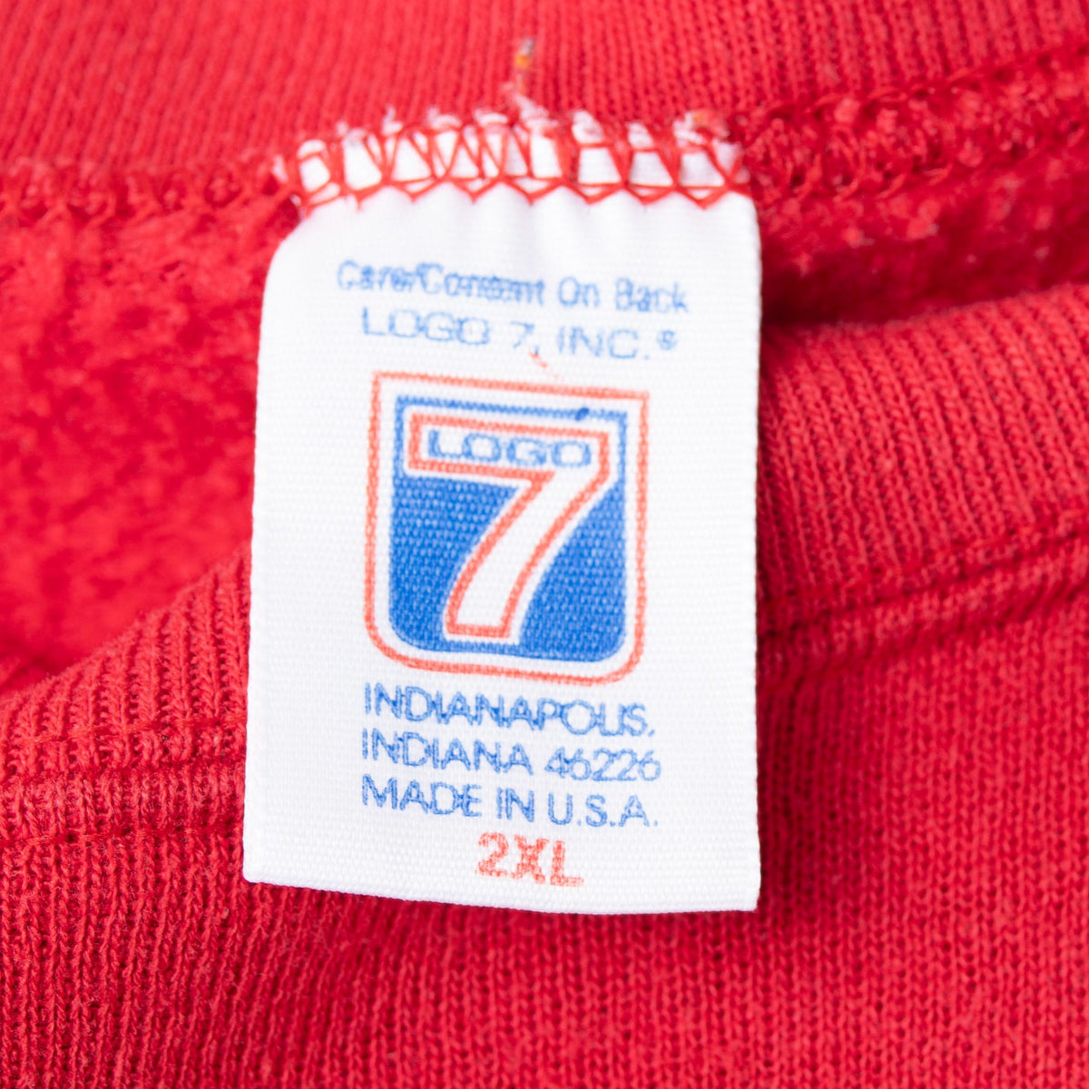 Logo 7 neck tag marked 2XL and Made in USA inside red sweatshirt