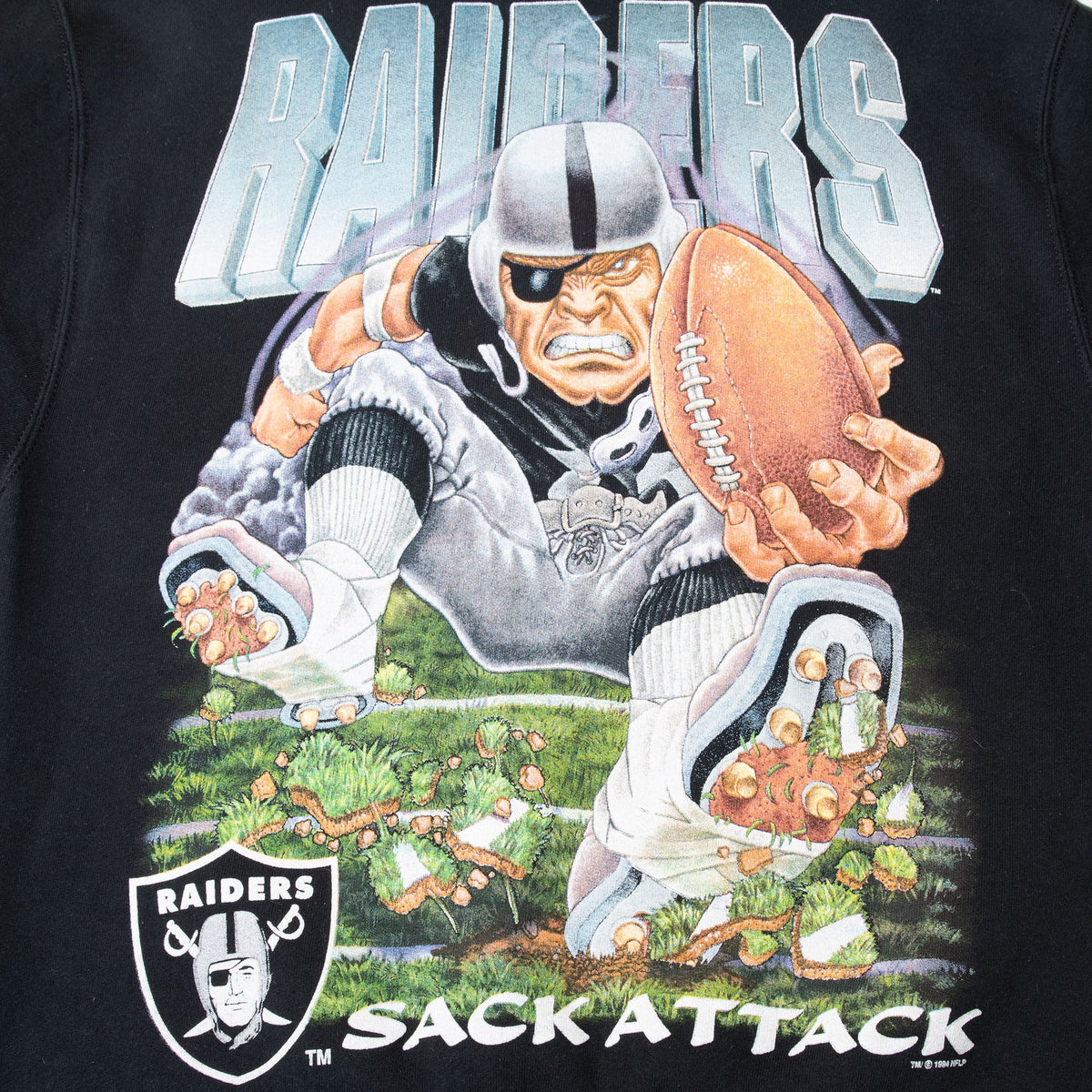 Close-up of Raiders Sack Attack front graphic with football player breaking through the field