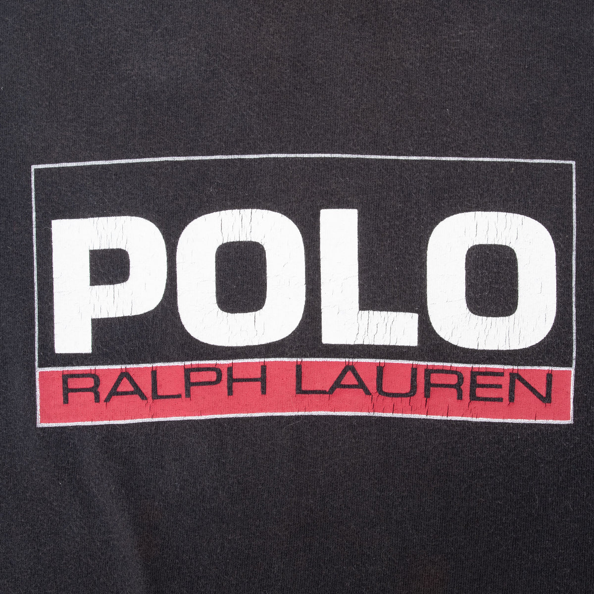 Close-up of white and red Polo Ralph Lauren chest graphic on black fabric
