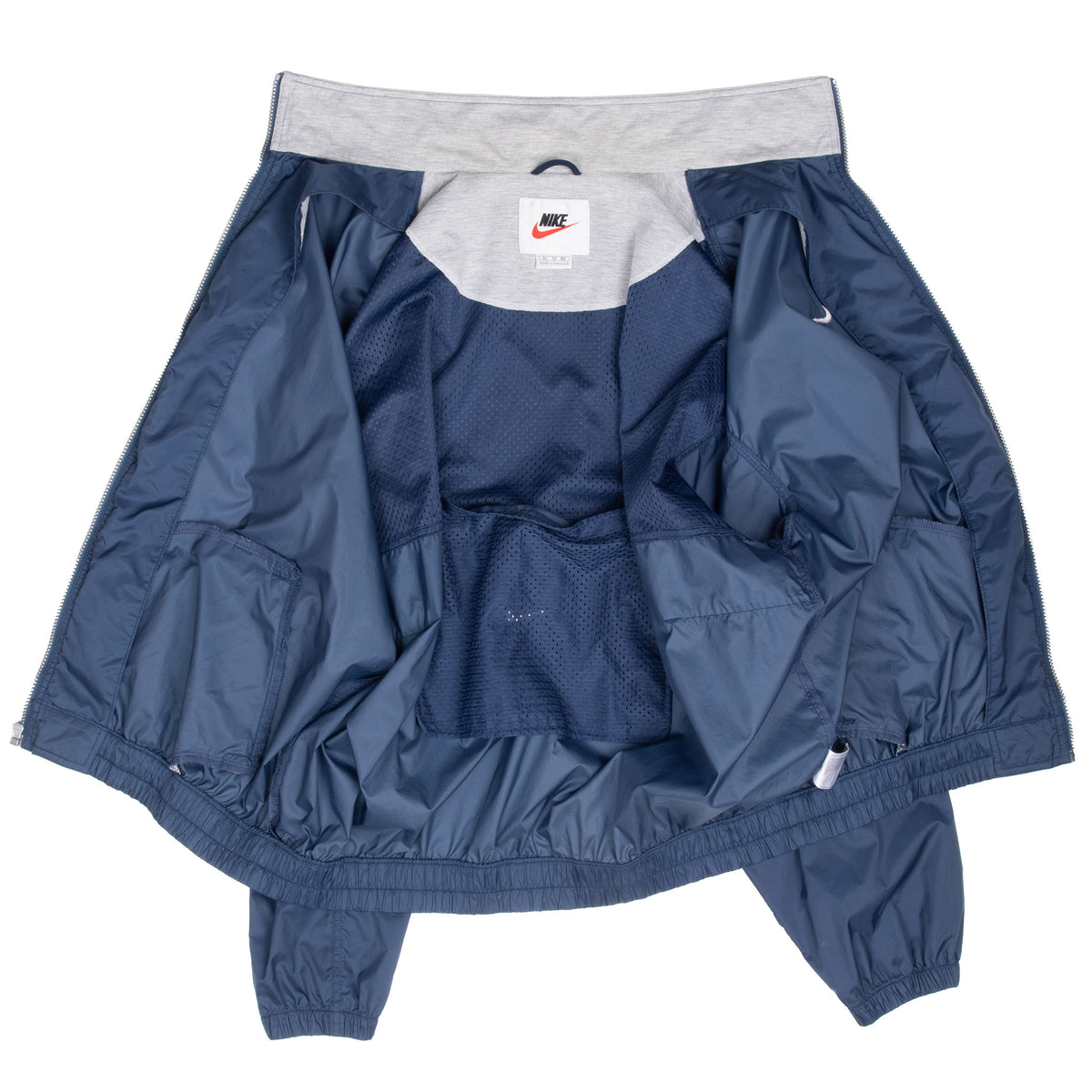 Open Nike windbreaker showing gray collar lining, navy mesh interior, and pockets