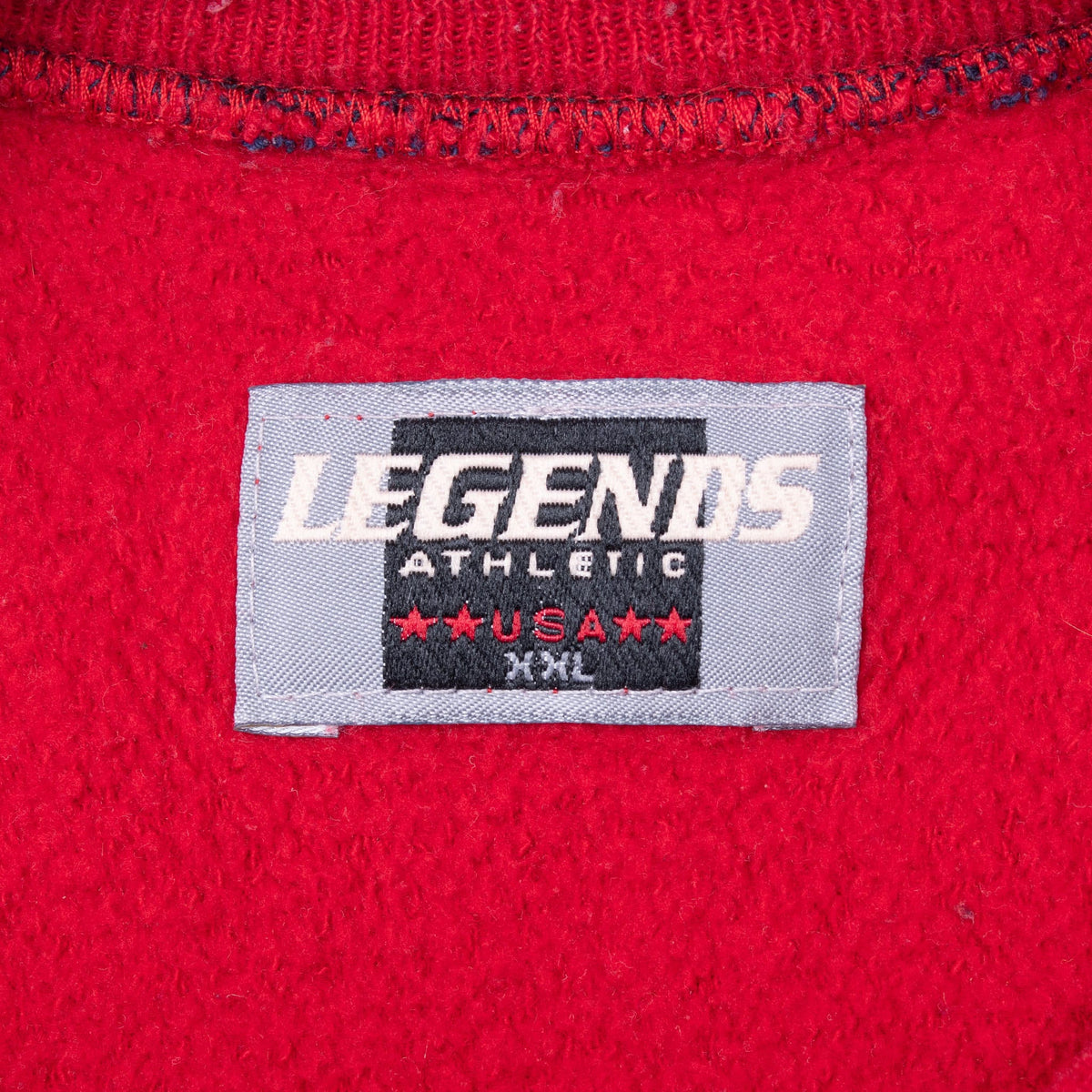 Legends Athletic neck label showing USA and XL on red sweatshirt interior