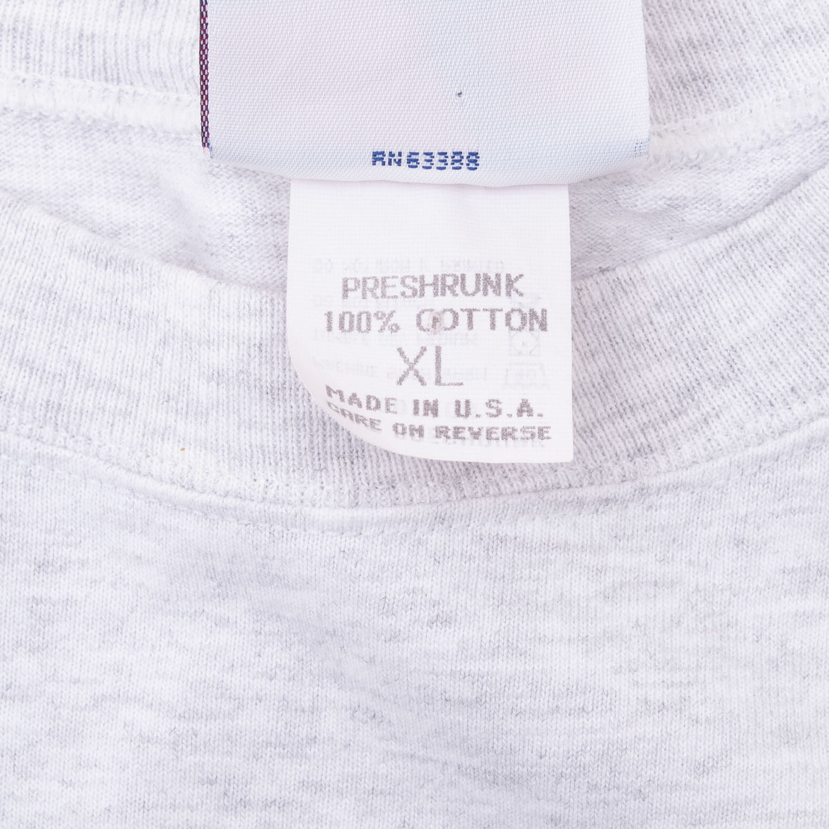 Close-up of XL size and care label inside gray San Francisco 49ers T-shirt