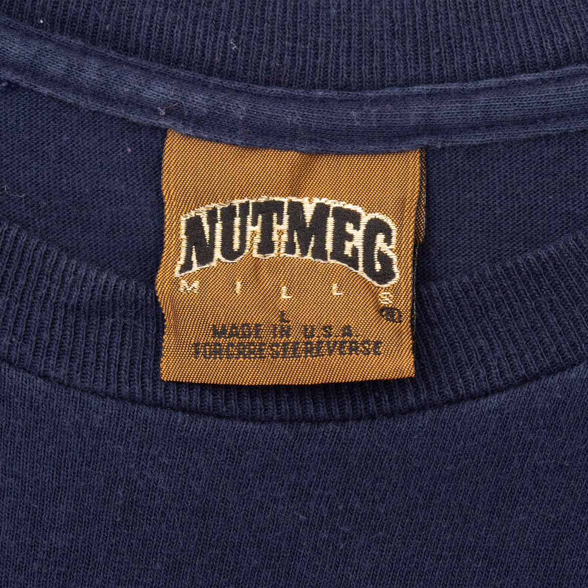 Nutmeg Mills size large neck tag on navy Minnesota Twins T-shirt