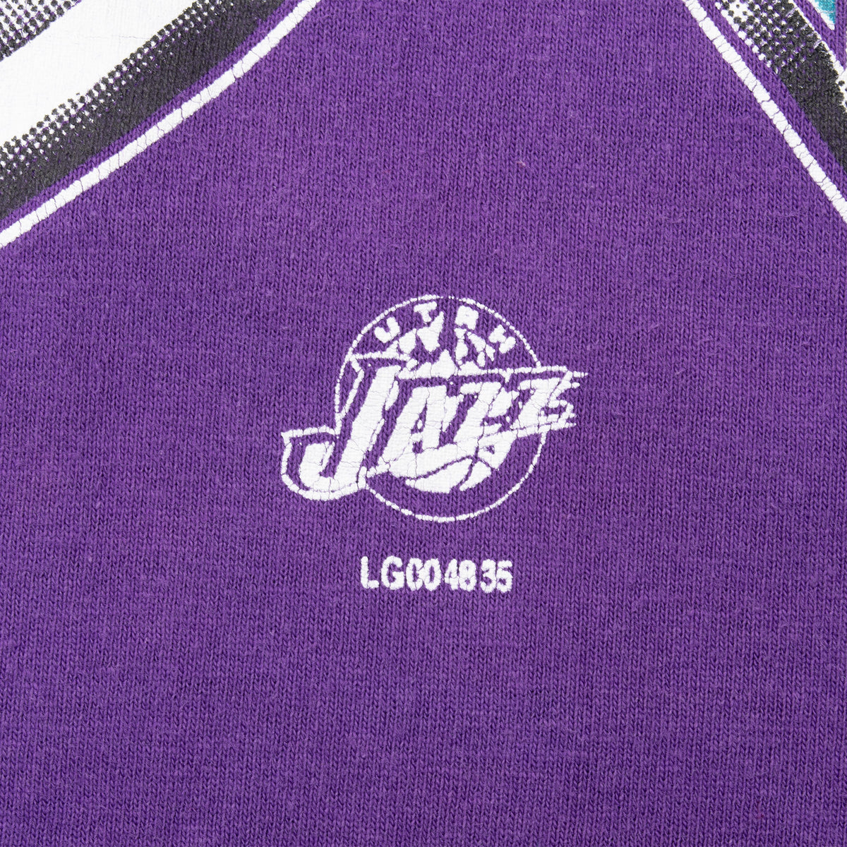 Close-up of small NBA Utah Jazz logo and code printed on purple shirt