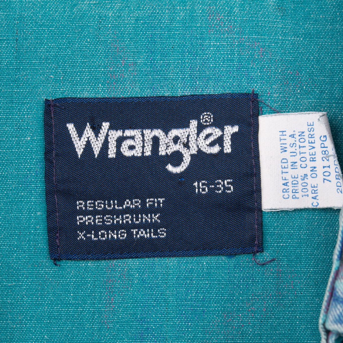 Wrangler neck and care labels showing 16-35, regular fit, preshrunk and X-long tails