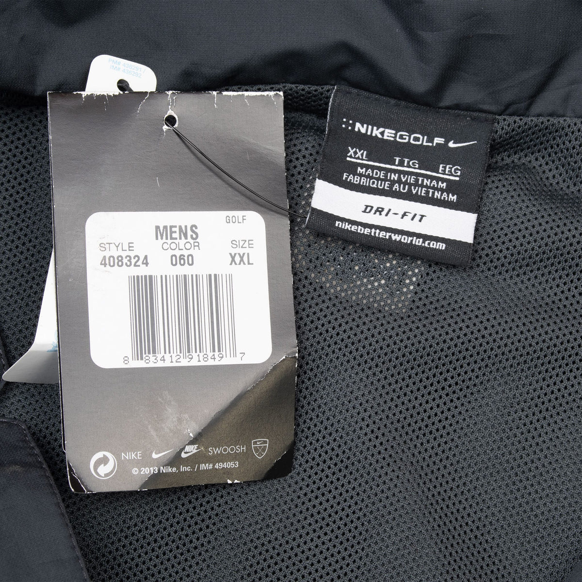 Nike Golf XXL neck label and attached 2013 hangtag inside black windbreaker