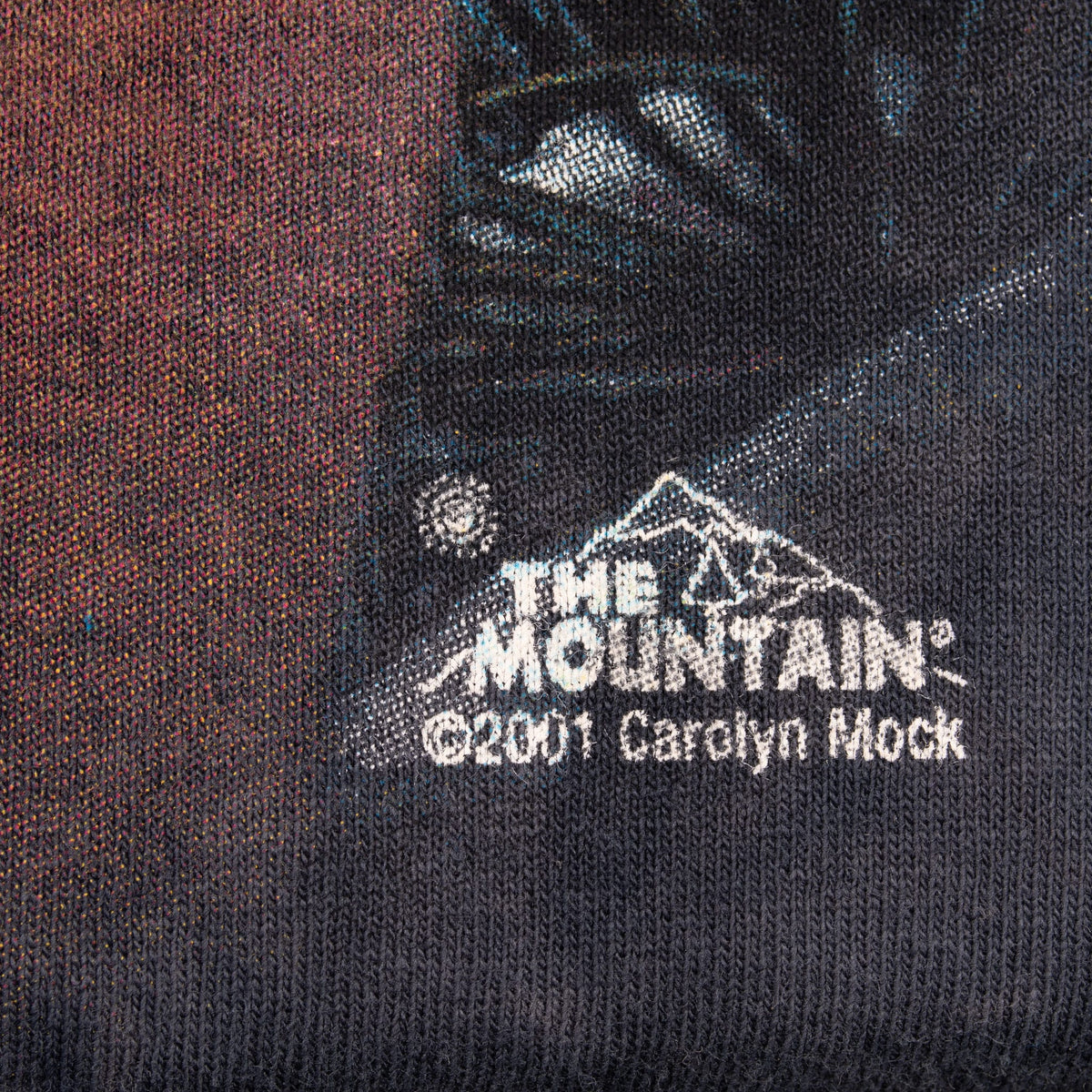 Close-up of The Mountain graphic copyright mark dated 2001 and signed Carolyn Mock