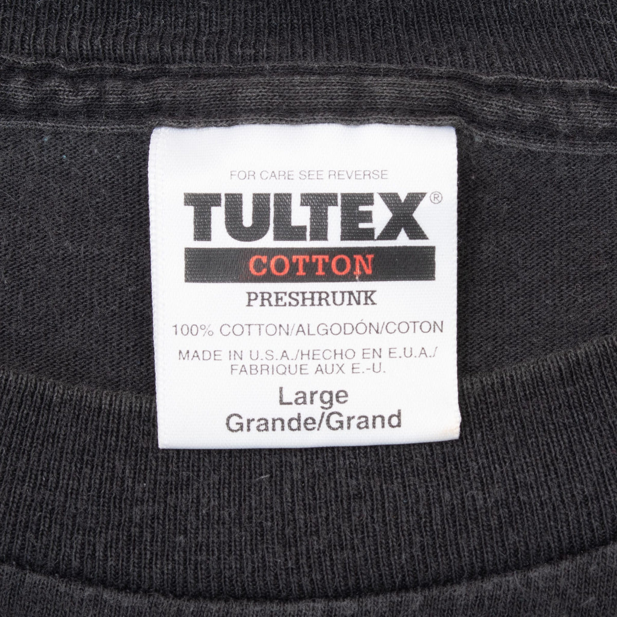 Tultex neck label marked Large, 100% cotton and made in USA