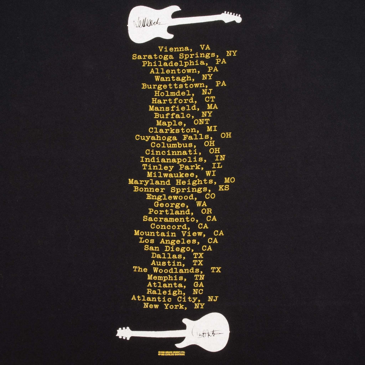 Close-up of back tour city list in yellow between two white guitar graphics