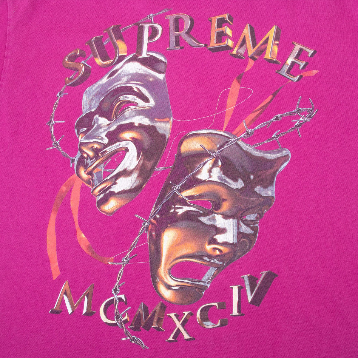 Close-up of back print with Supreme lettering, drama masks, barbed wire and Roman numerals