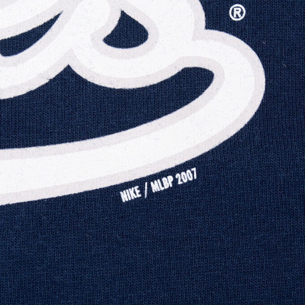 Close-up of Nike MLBP 2007 text beneath the Yankees chest graphic