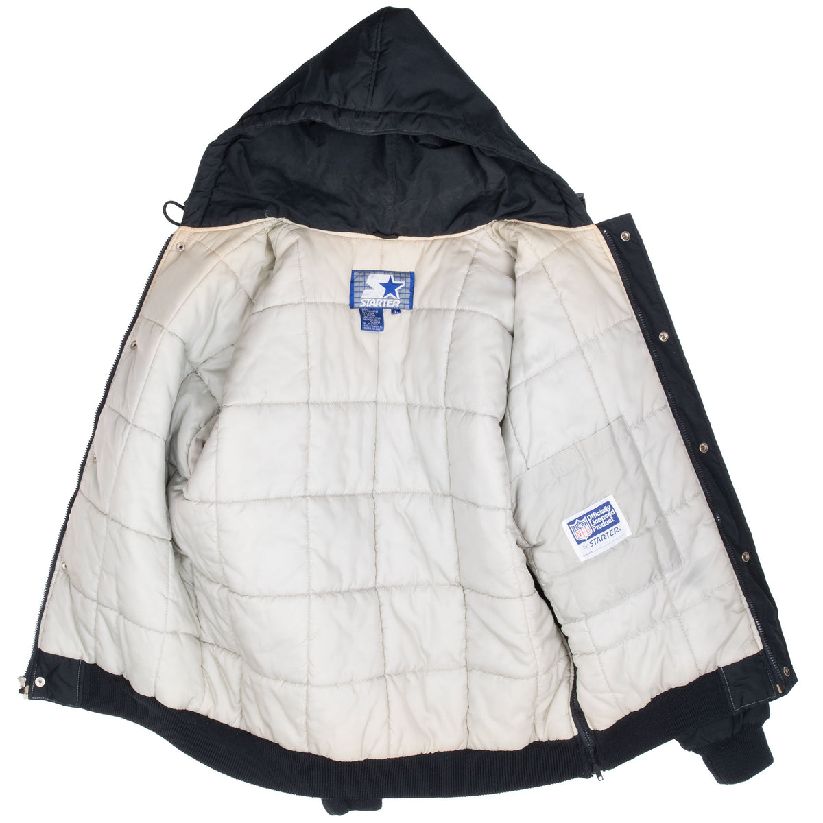 Open Los Angeles Raiders Starter jacket showing light-colored quilted lining and interior labels