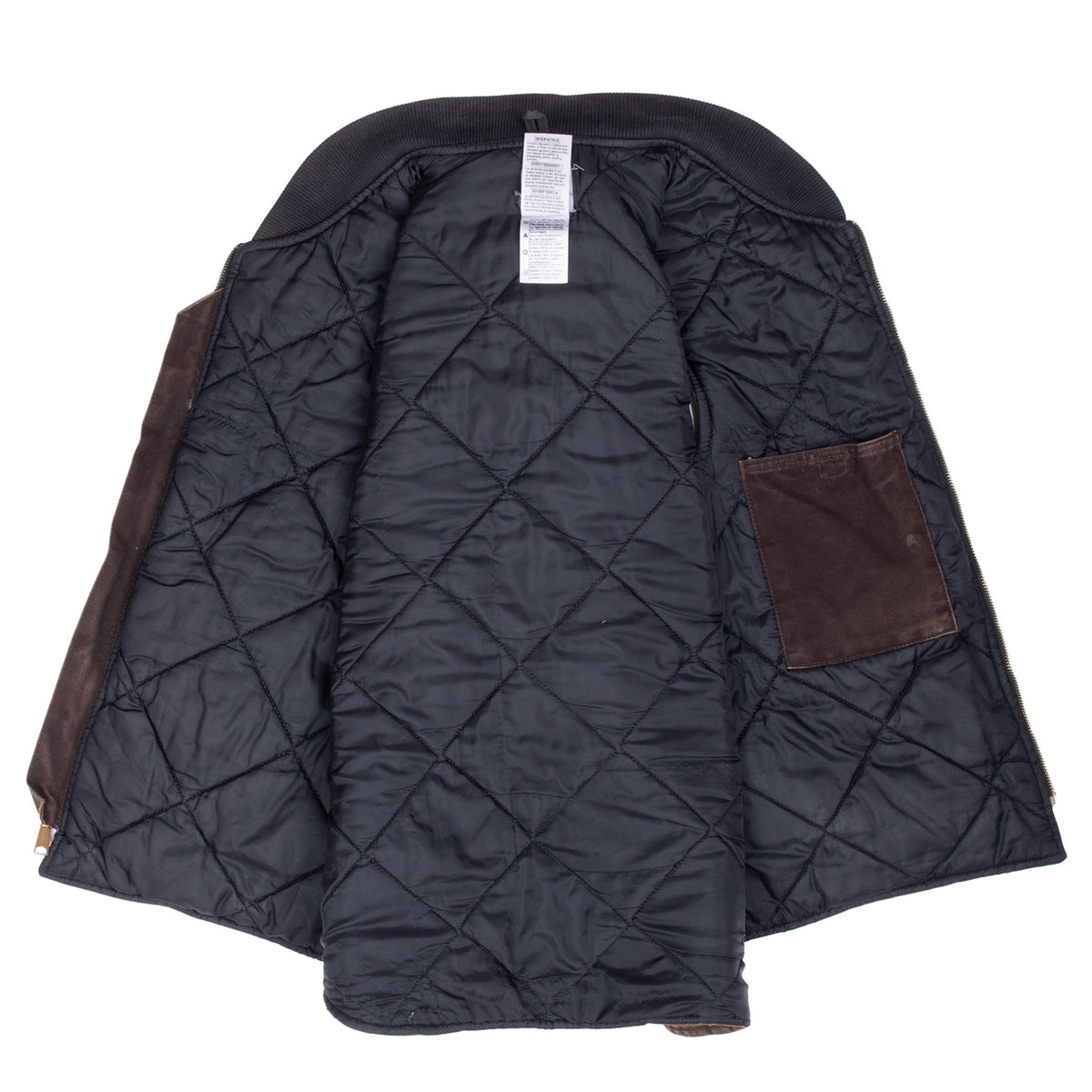 Open Carhartt vest showing black diamond-quilted lining, label, and interior patch pocket