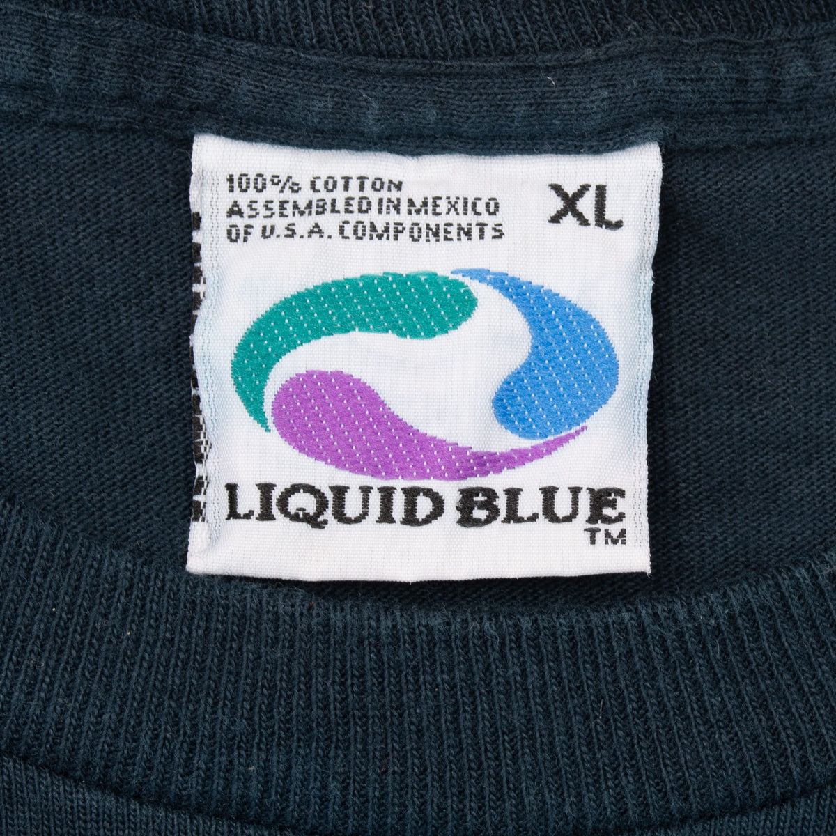 Liquid Blue XL neck tag showing 100% cotton and assembled in Mexico of U.S.A. components