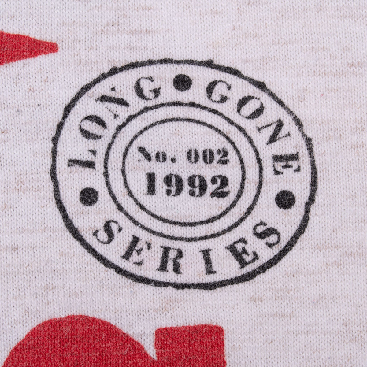 Close-up of printed Long Gone Series No. 002 1992 circular mark
