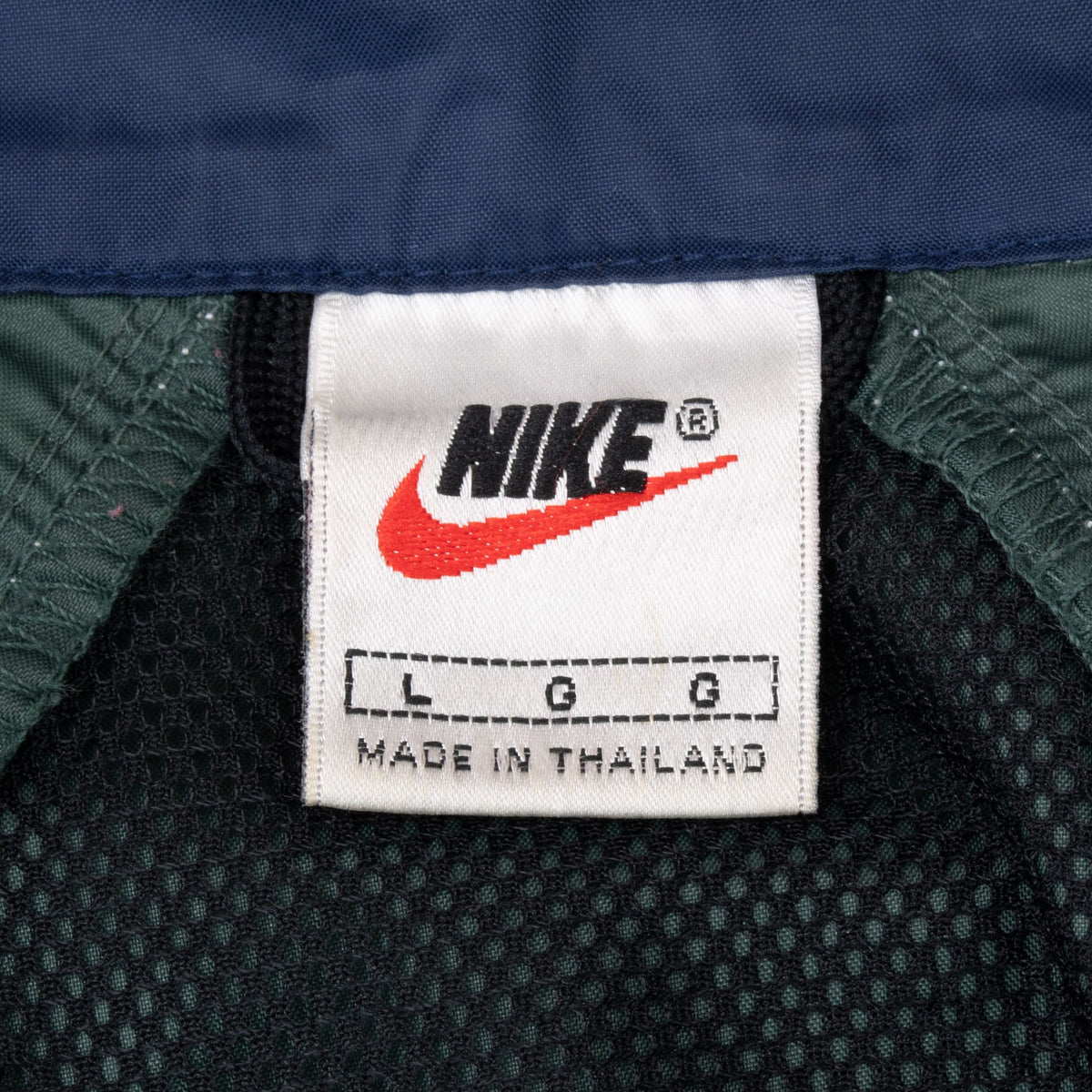 Nike neck label showing size large and Made in Thailand