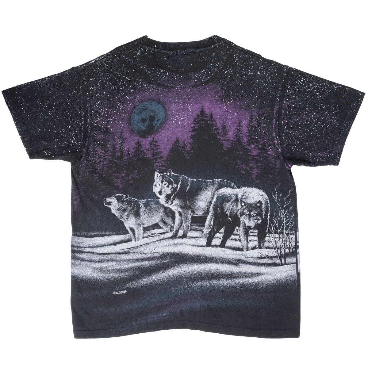 Back of black T-shirt with three wolves in a snowy forest beneath a blue moon and purple sky