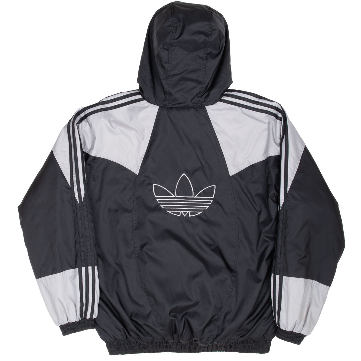 Back of black and grey Adidas windbreaker with large outlined Trefoil logo