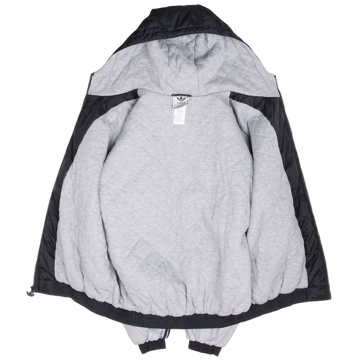 Open Adidas windbreaker showing grey interior lining and neck label