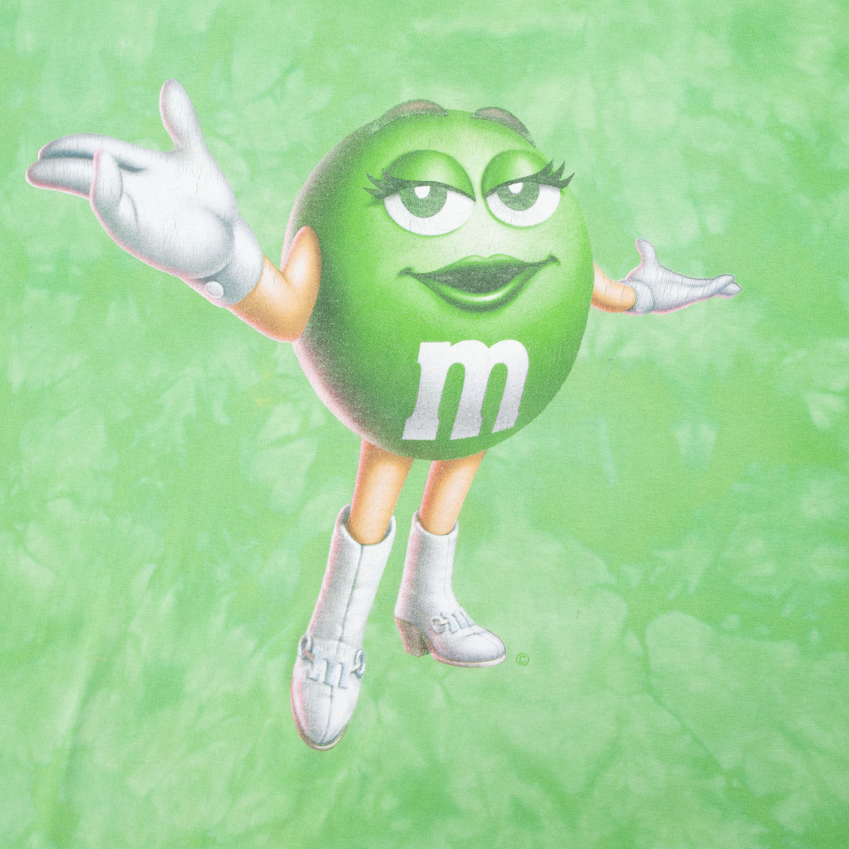 Close-up of Green M&M character print on green tie-dye T-shirt