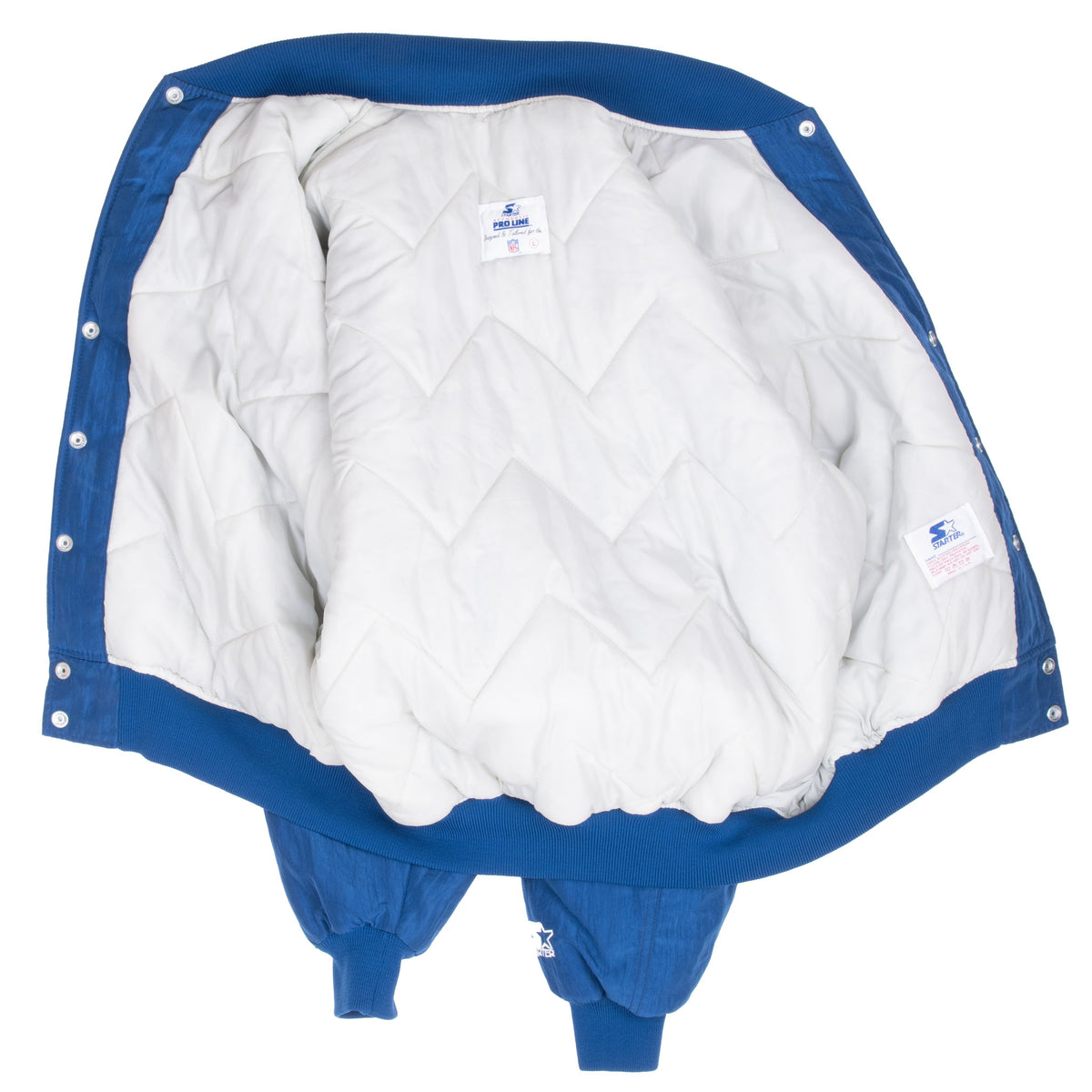 Open Dallas Cowboys Starter jacket showing white quilted lining and interior labels