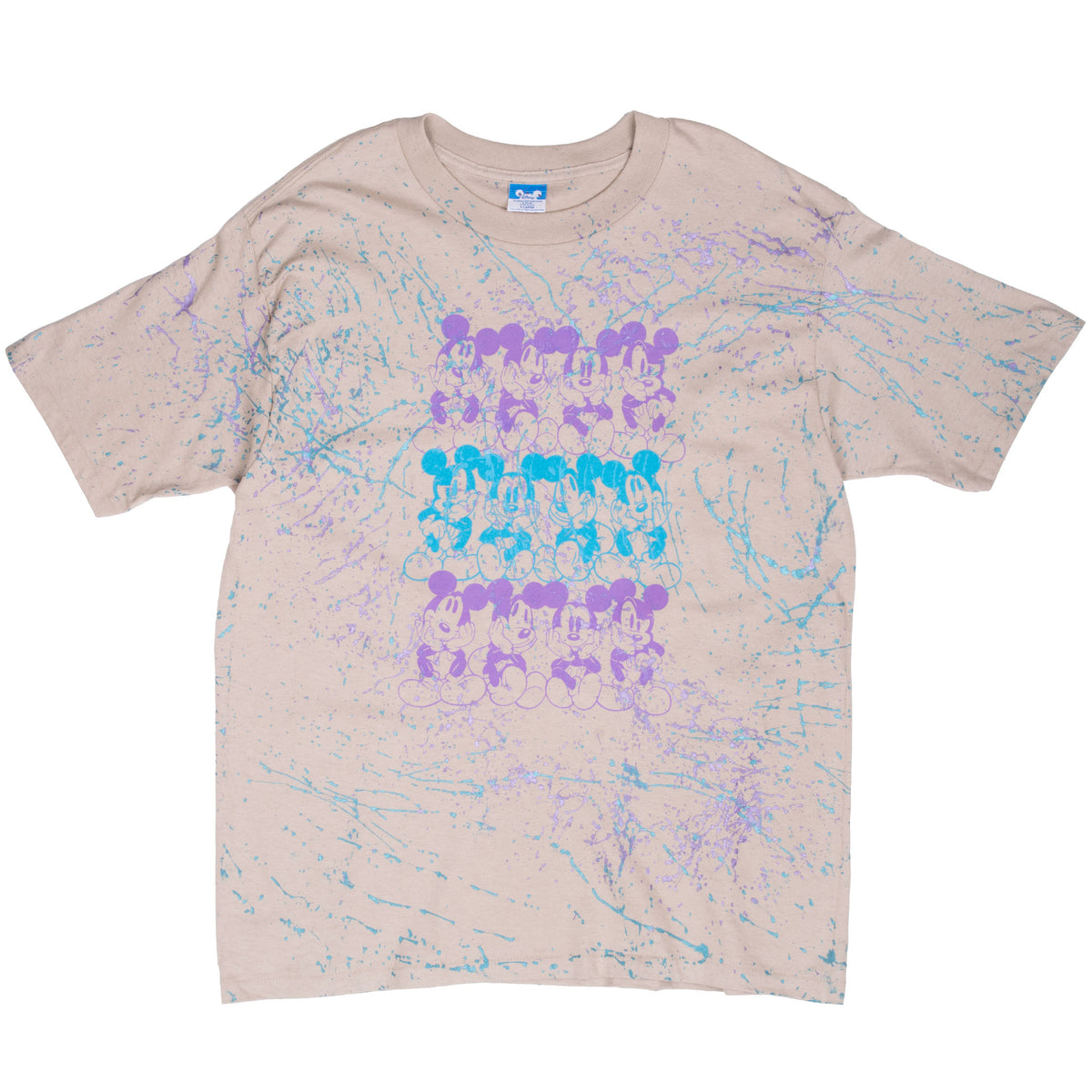 Front of beige Disney tee with rows of Mickey Mouse figures and blue and purple splatter print