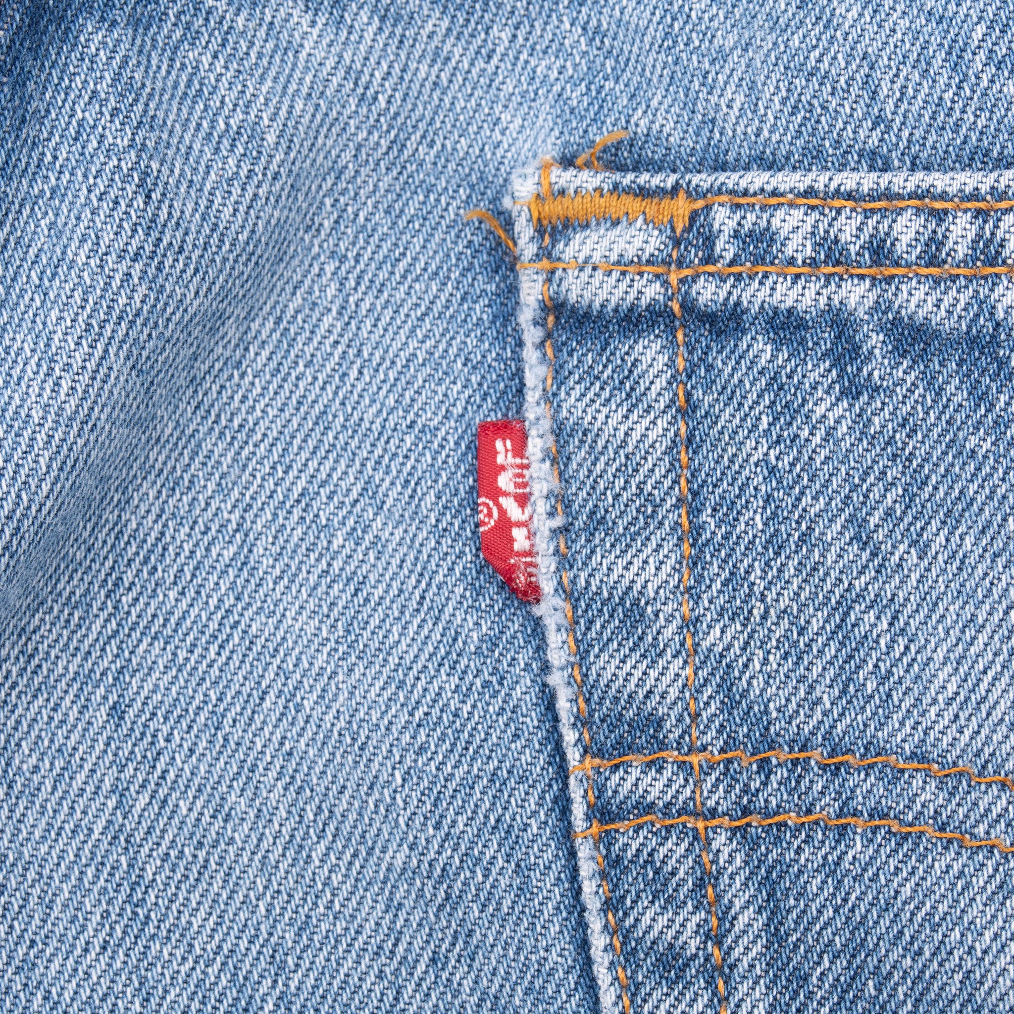Vintage Levis 501 Indigo Jeans 1990S Size 36X28 Made In Usa With a beautiful Medium Light Wash and some beautiful whiskers
Size on Tag 38X32 Actual size 36X28
Back Button #555