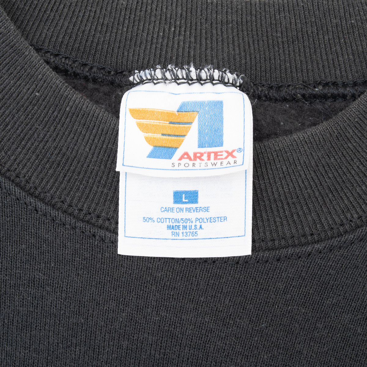 Artex Sportswear size large neck tag on black sweatshirt