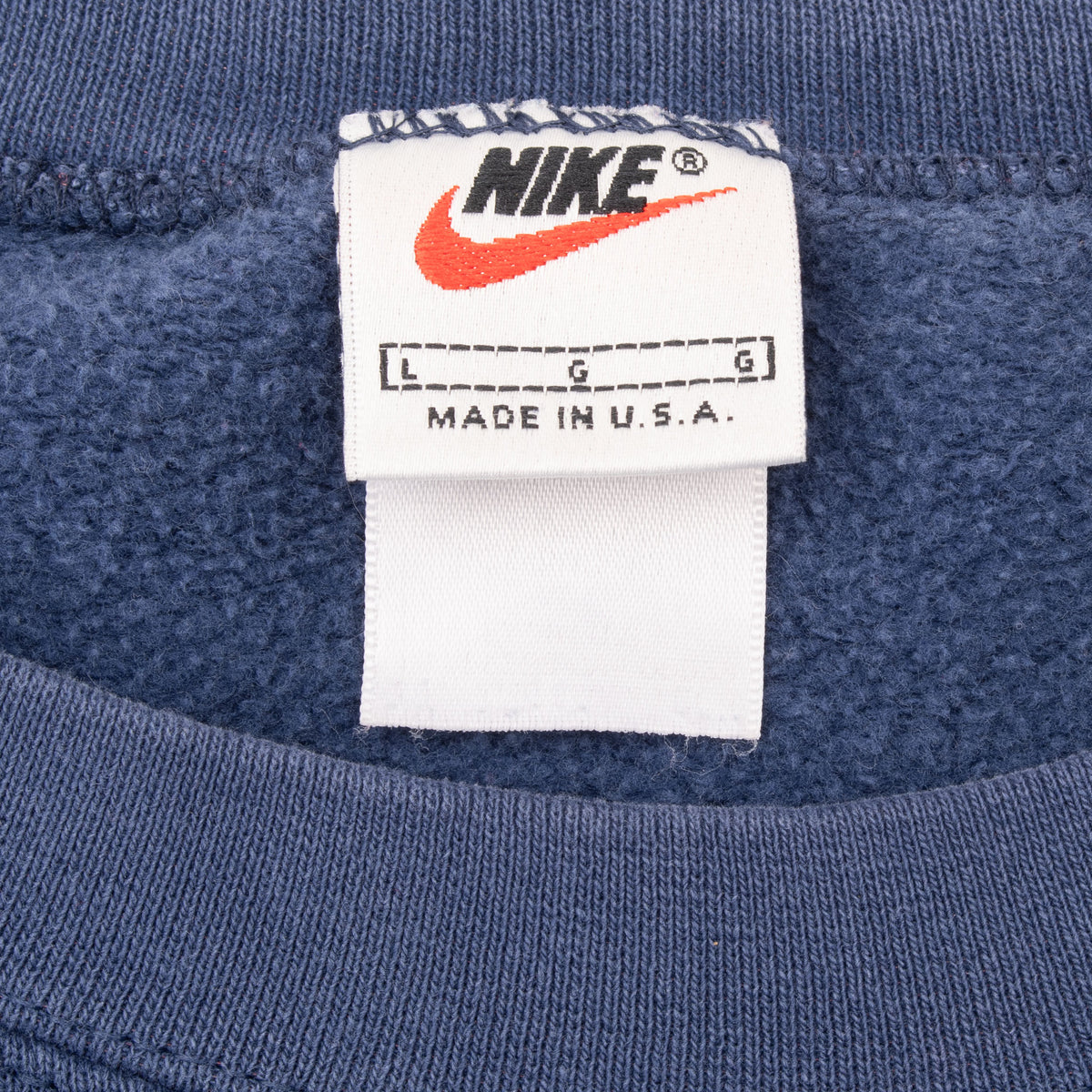 Nike neck tag showing size large and Made in U.S.A. text