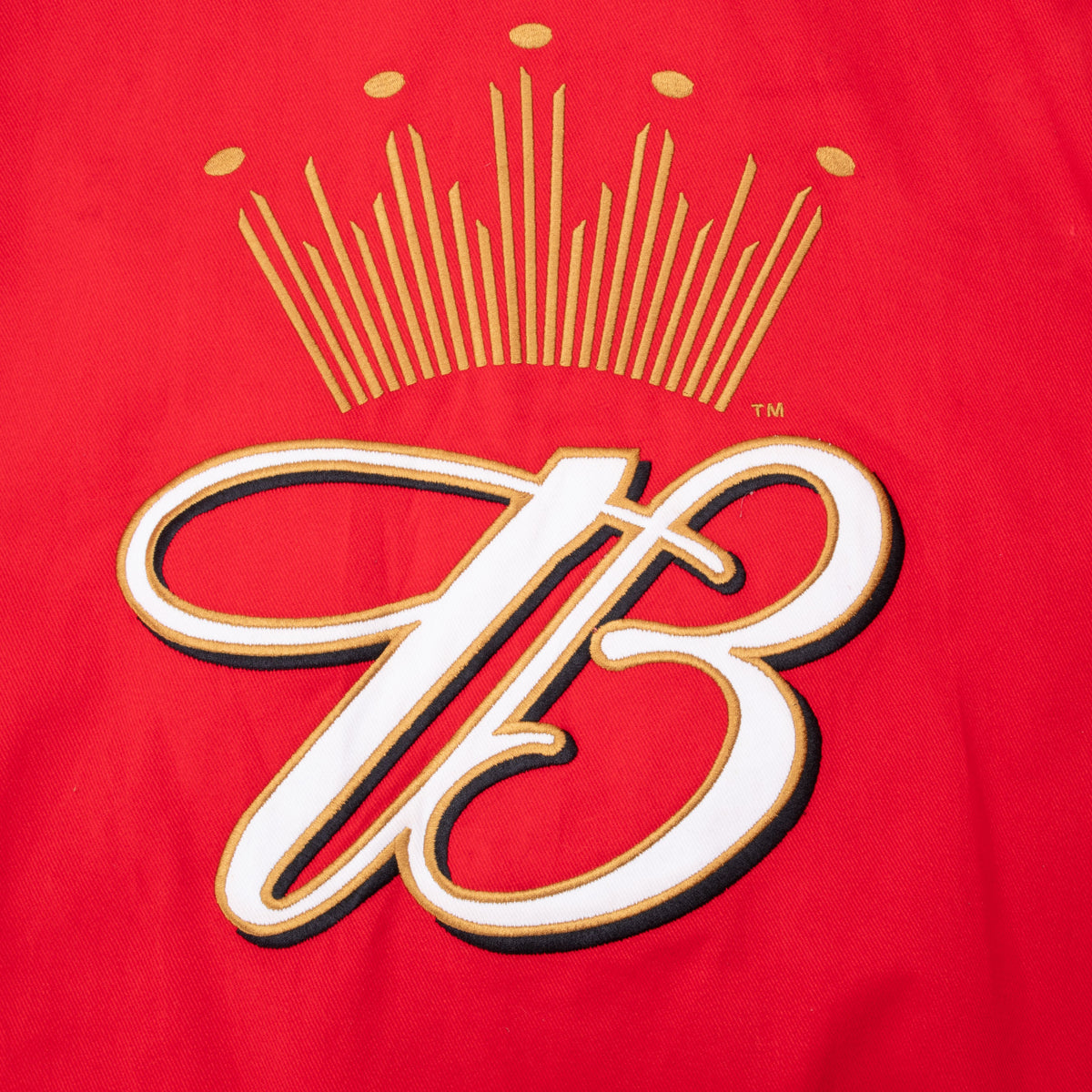 Close-up of large crowned Budweiser B embroidery on jacket back
