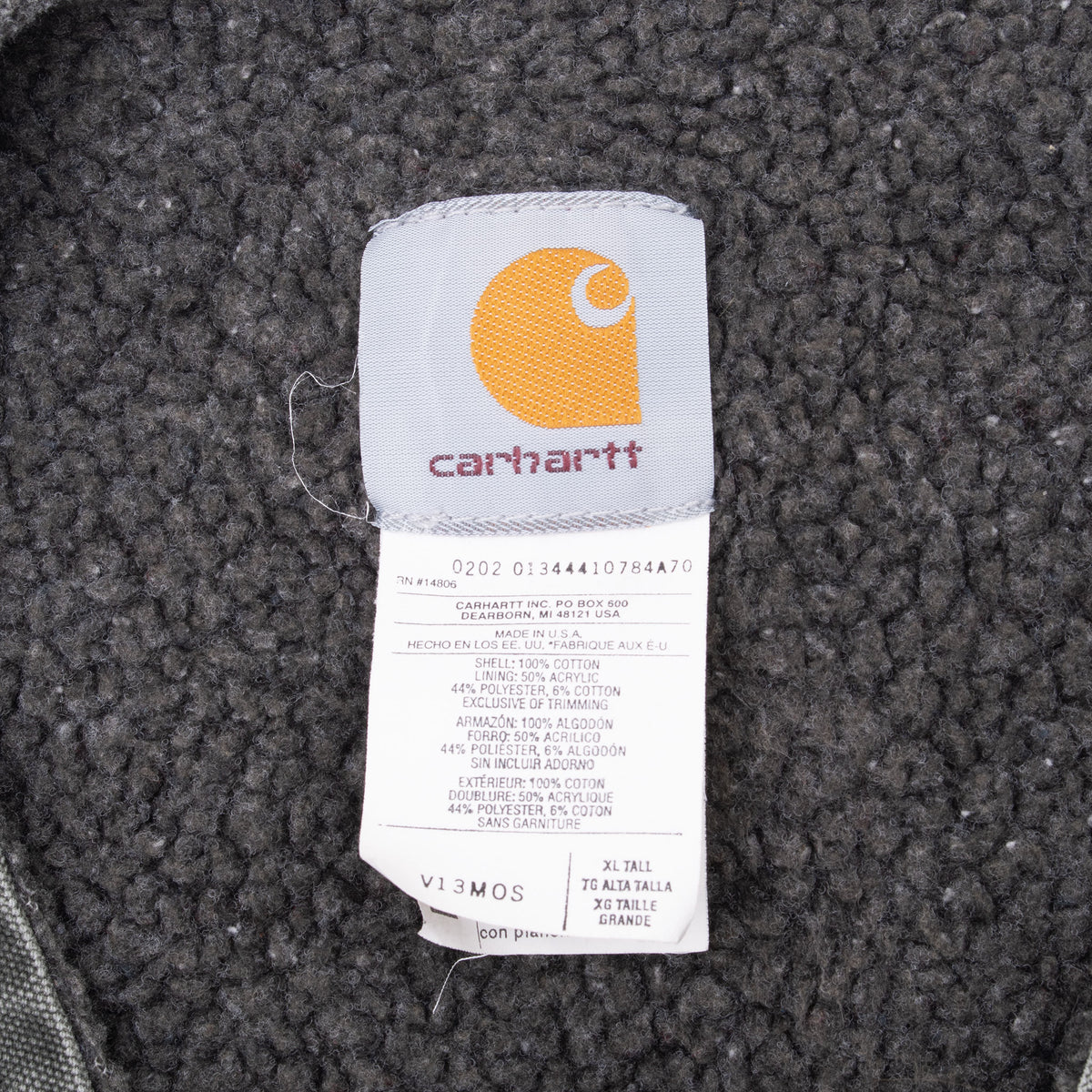Carhartt neck label on sherpa lining showing 2002 date code, V13MOS style, and XL Tall size