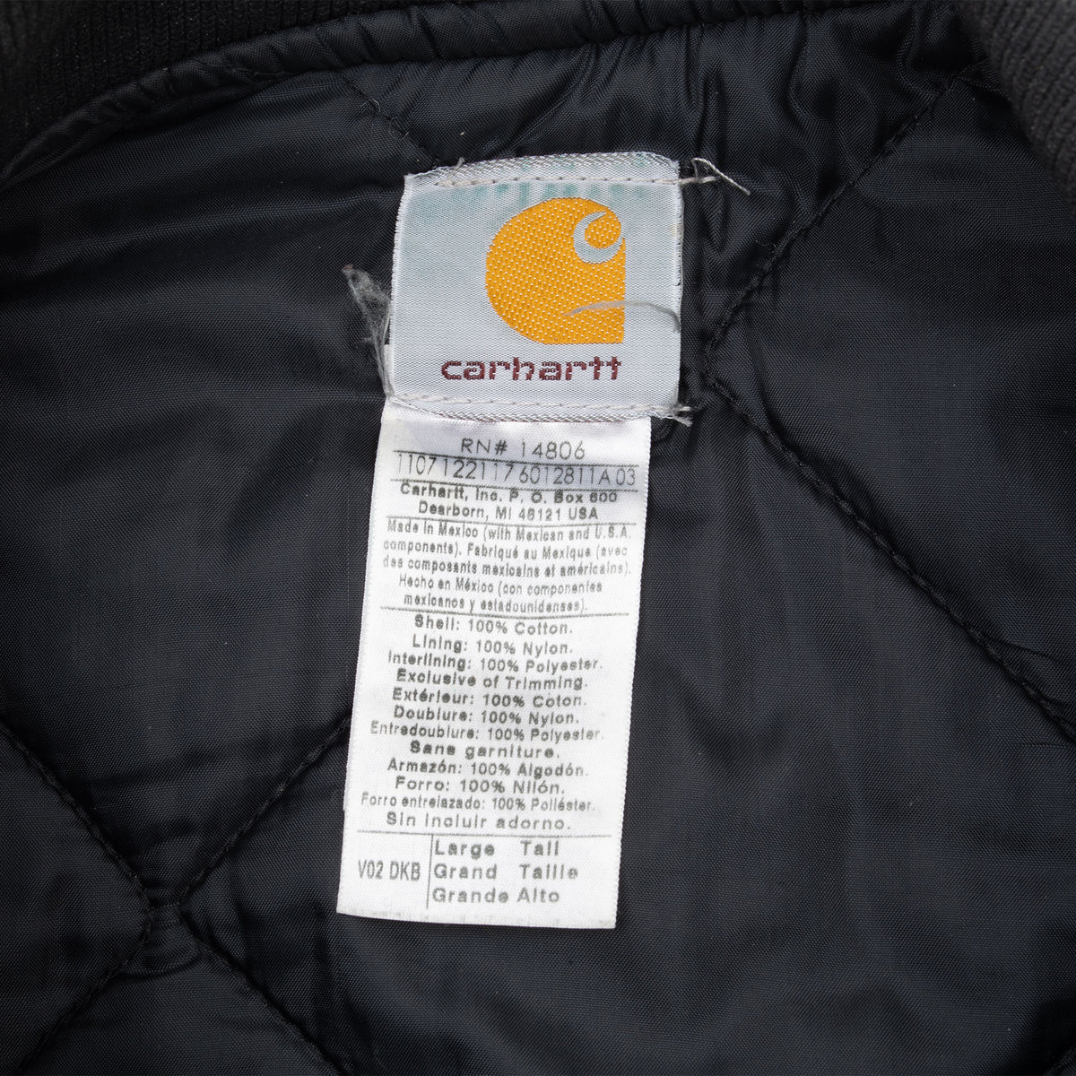 Carhartt neck and care labels inside black quilted lining, marked Large Tall and V02 DKB