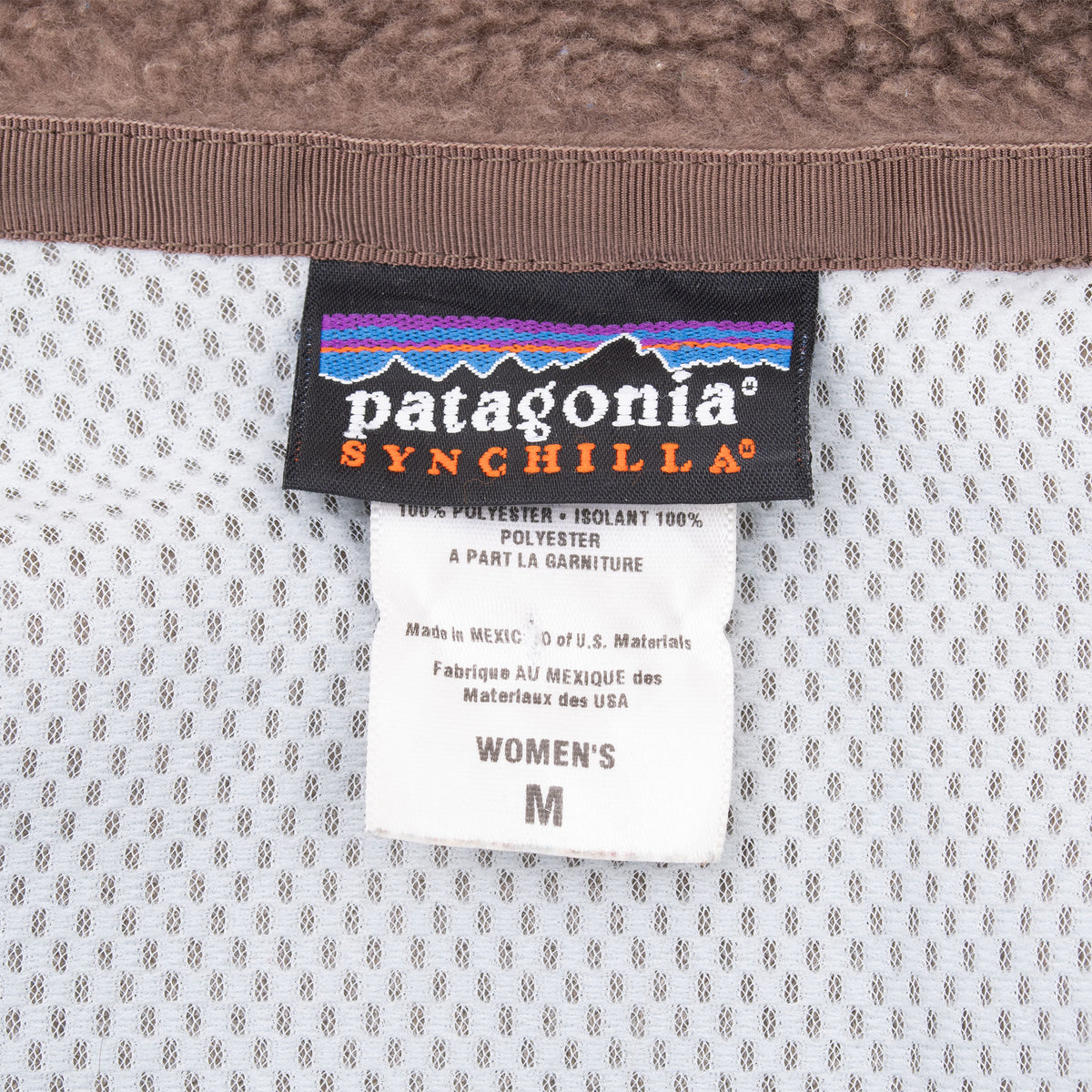Patagonia Synchilla neck label and women's medium size tag