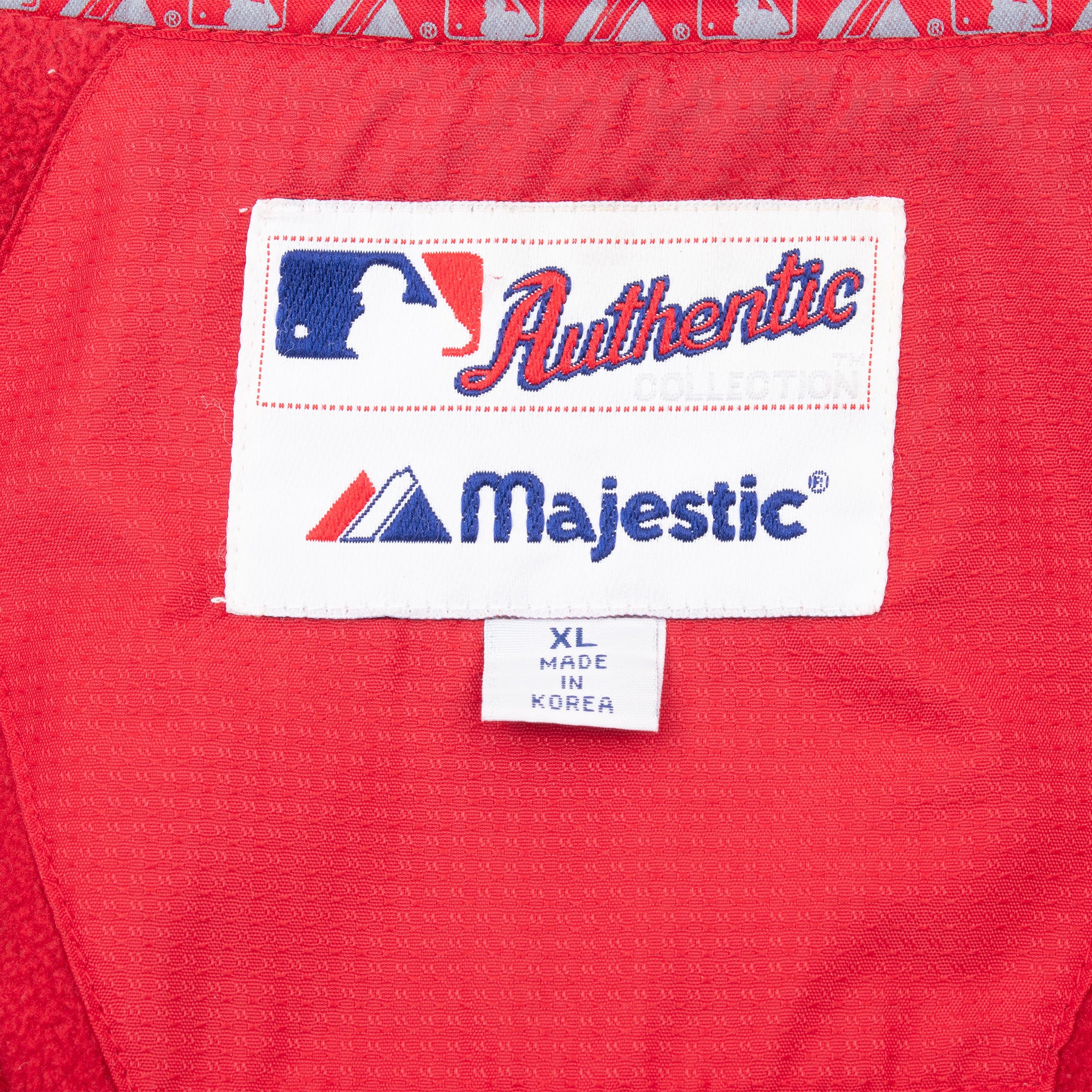 Majestic MLB neck label and XL size tag inside red Cardinals jacket