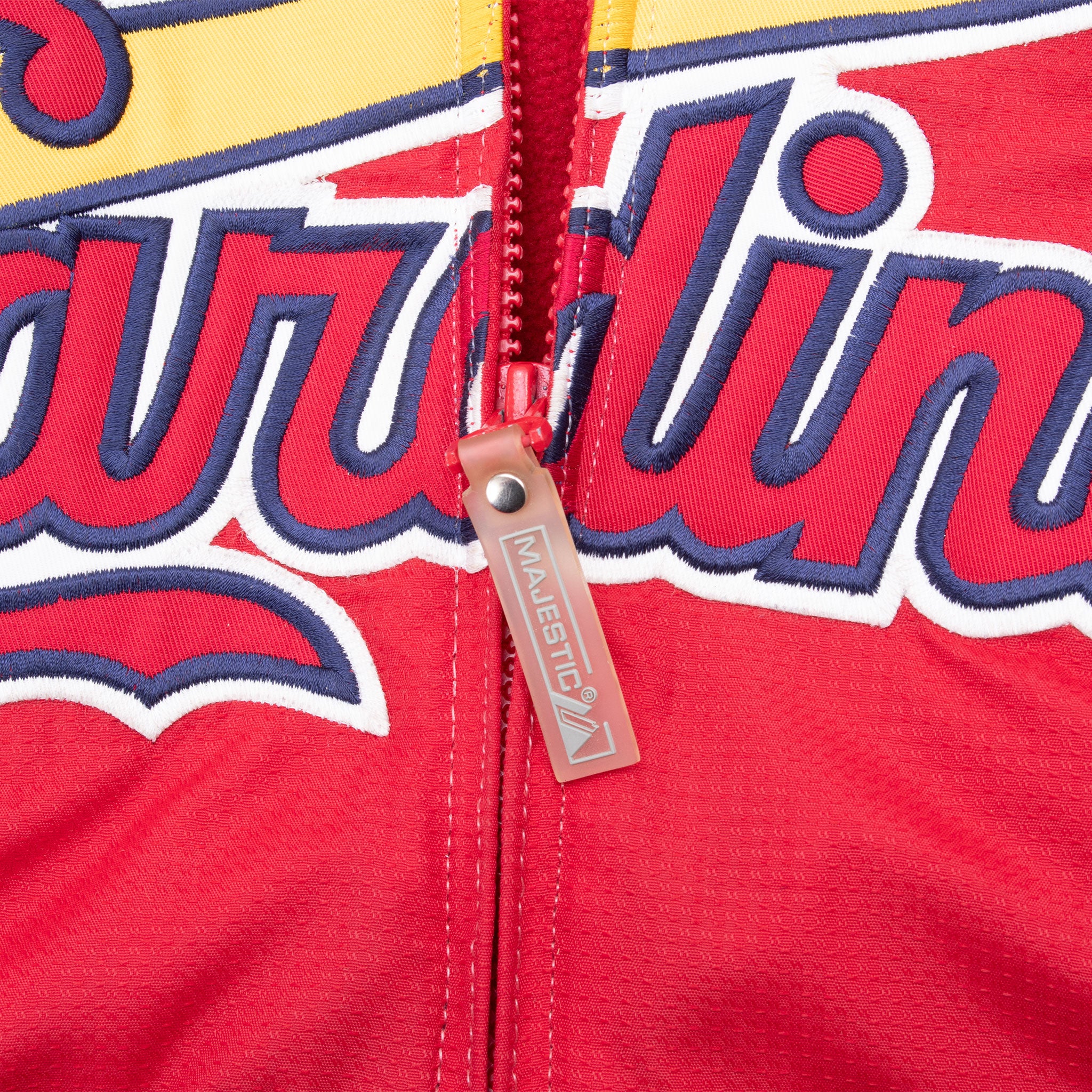 Close-up of Majestic zipper pull over Cardinals chest graphic