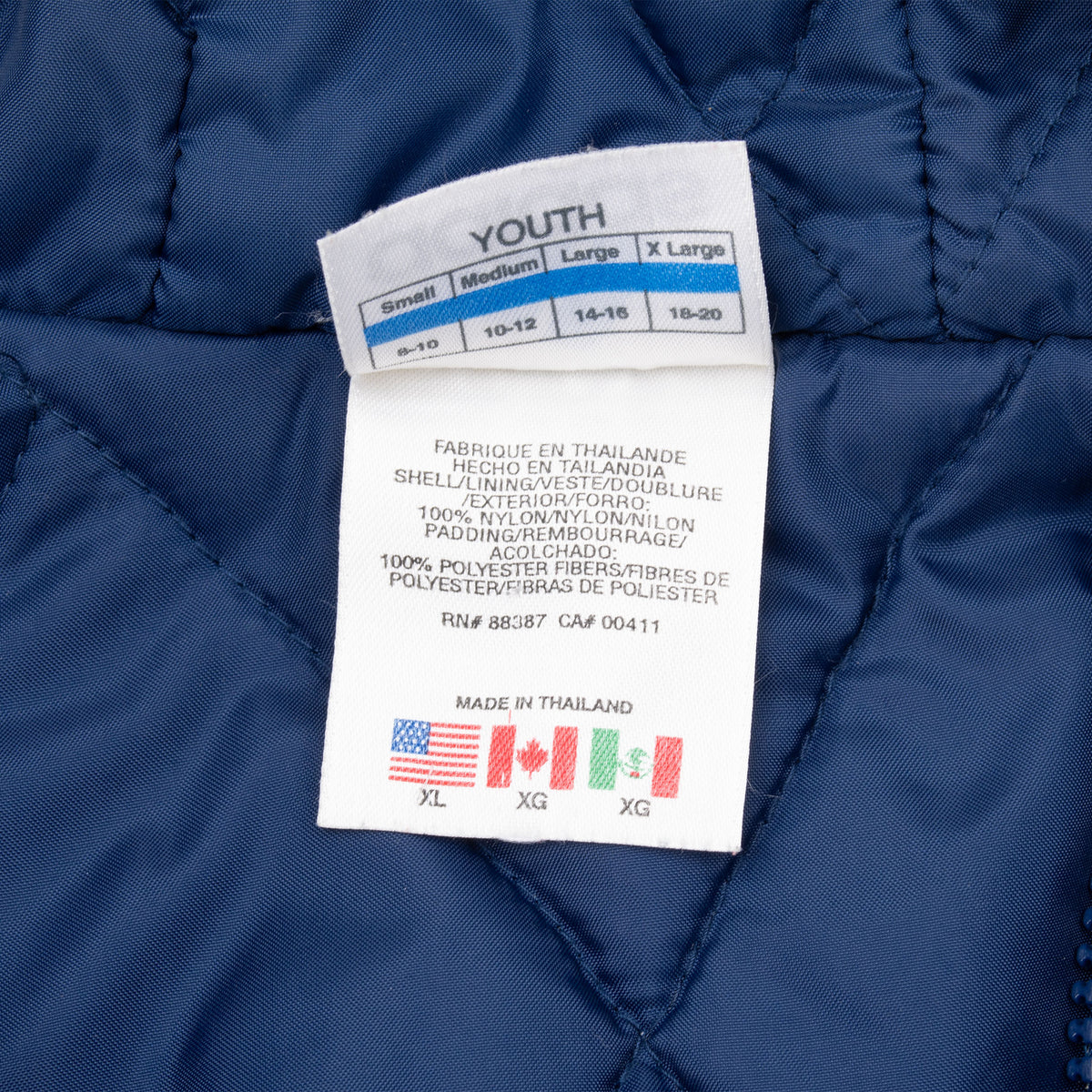 Youth sizing and care label marked X Large 18-20 inside Adidas jacket