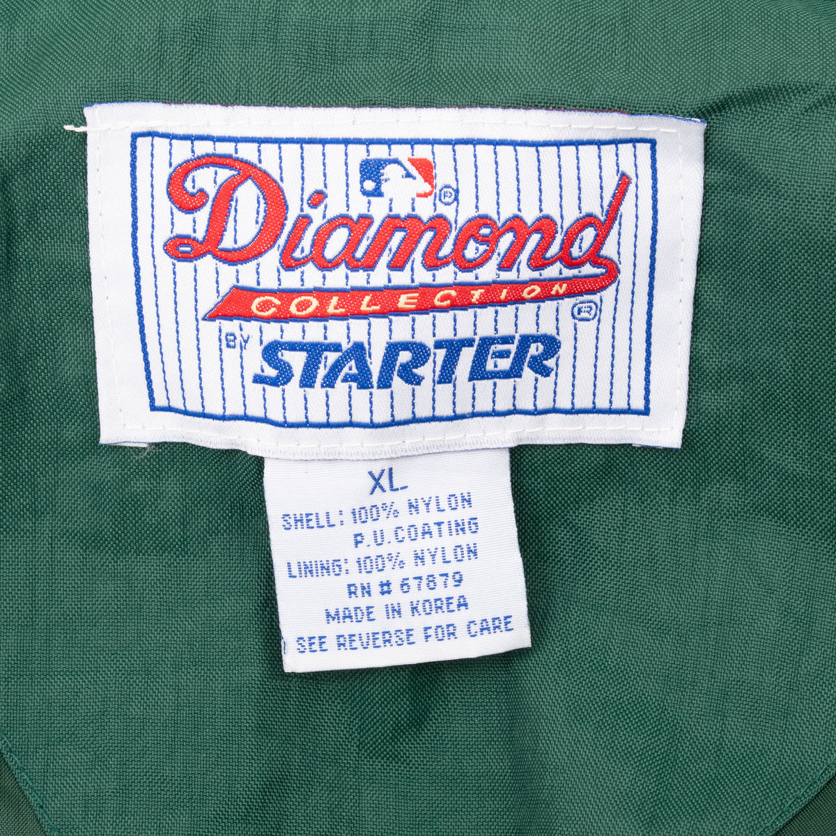 Starter Diamond Collection neck label and XL care tag inside green jacket