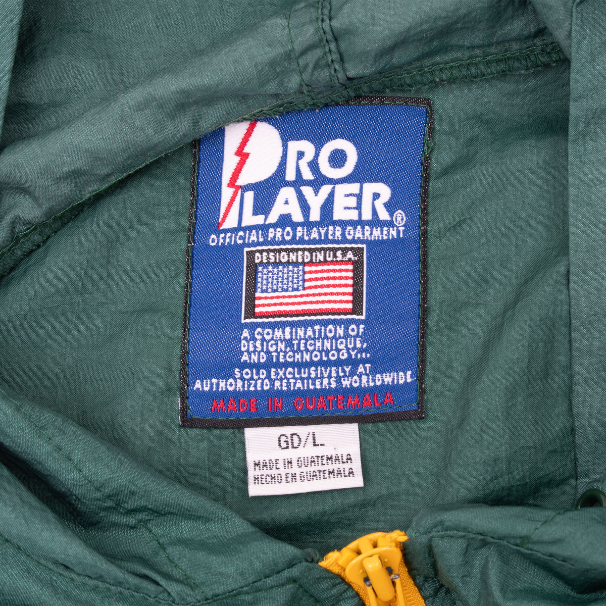 Close-up of Pro Player neck label and large size tag inside green Oregon windbreaker