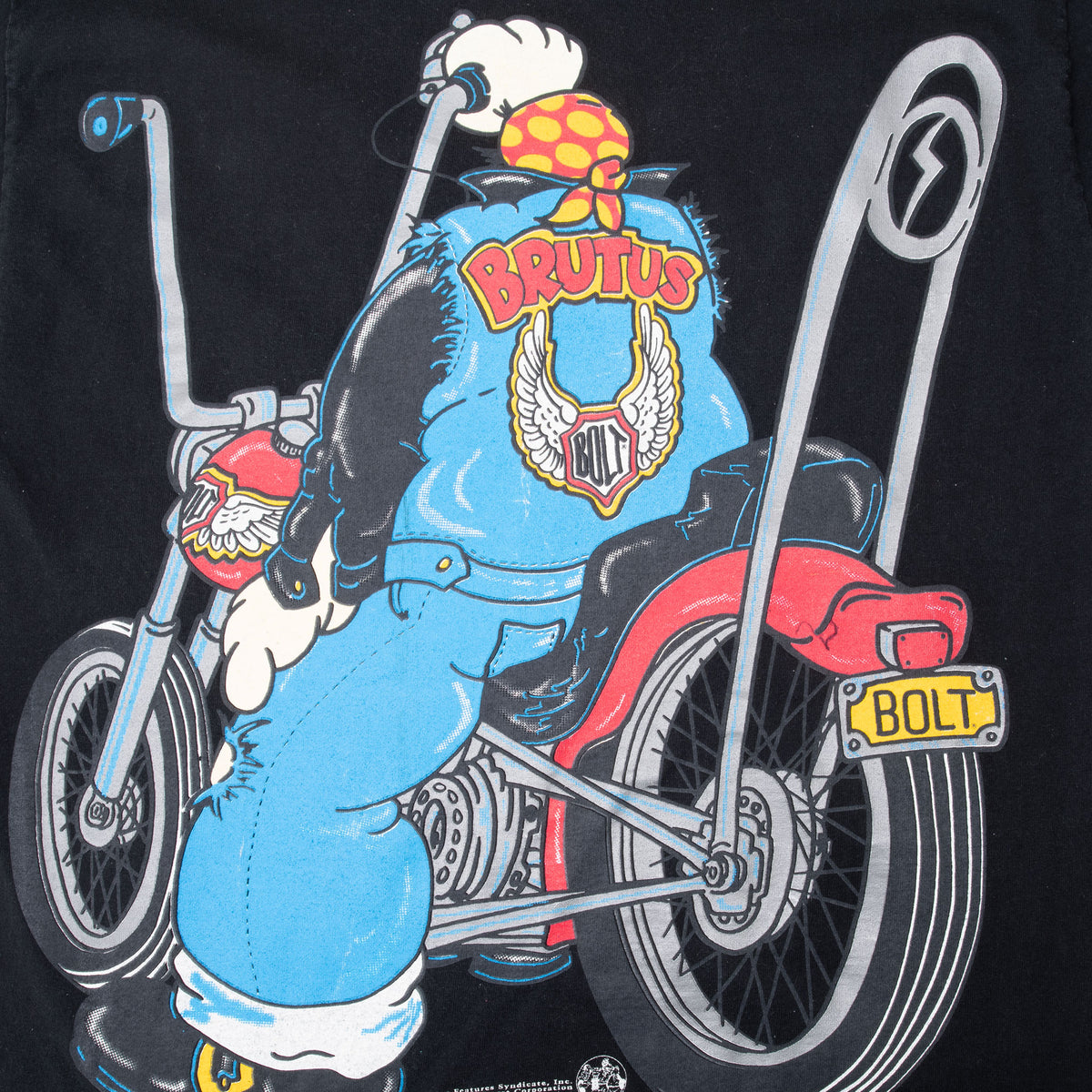 Close-up of back print showing Brutus on a motorcycle with Brutus and Bolt lettering