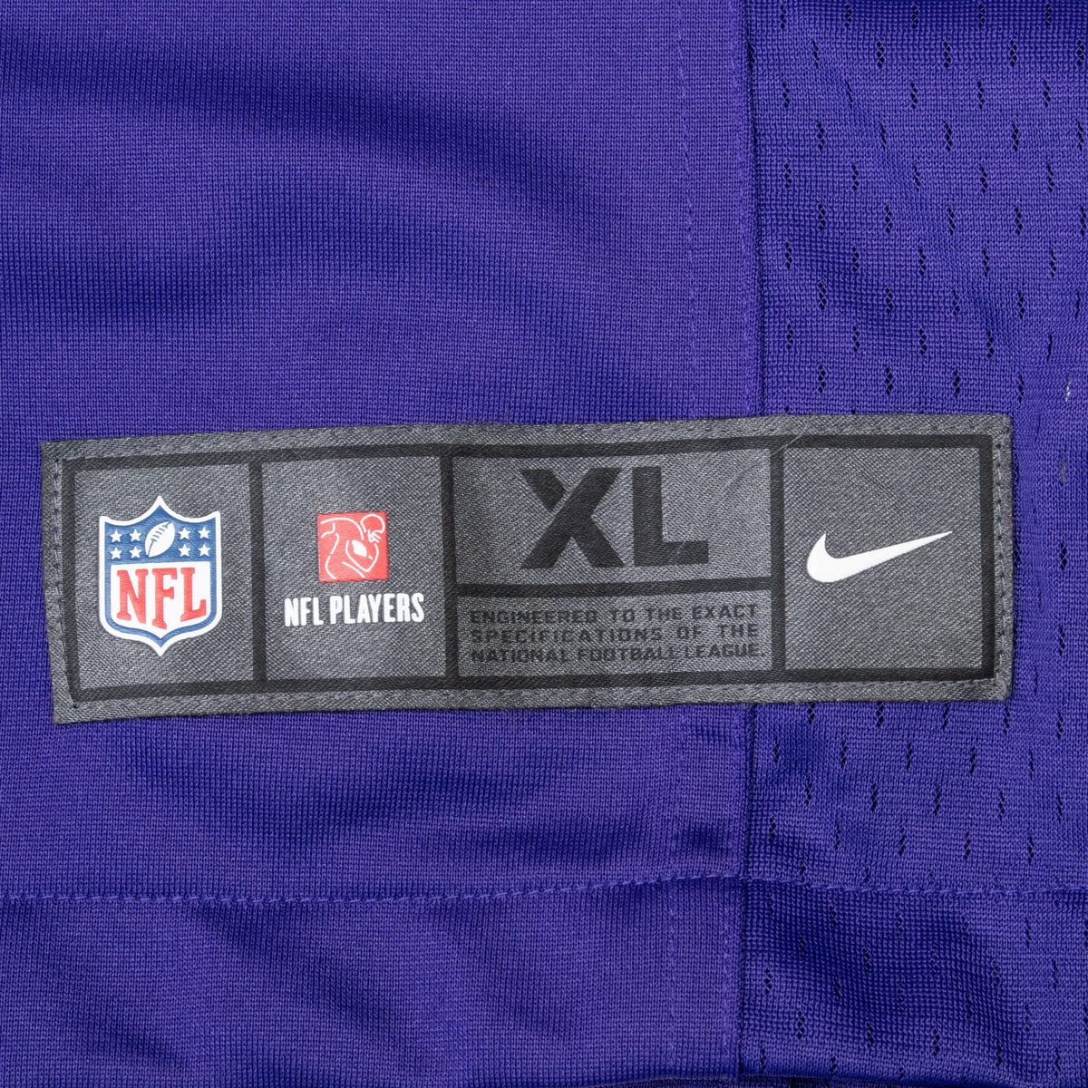 Nike NFL Players XL jock tag on purple mesh jersey fabric