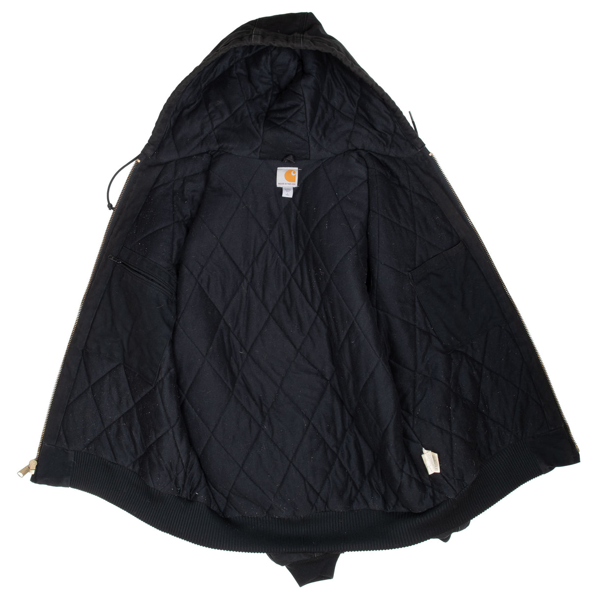 Open black Carhartt hooded jacket showing quilted lining and interior tags