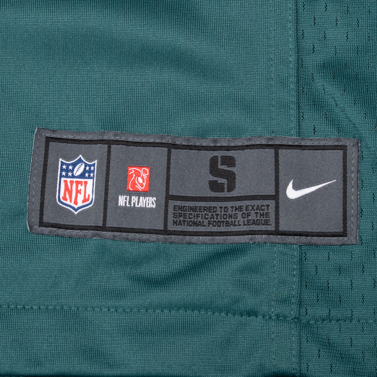 Nike NFL size small jock tag on lower front of green Eagles jersey