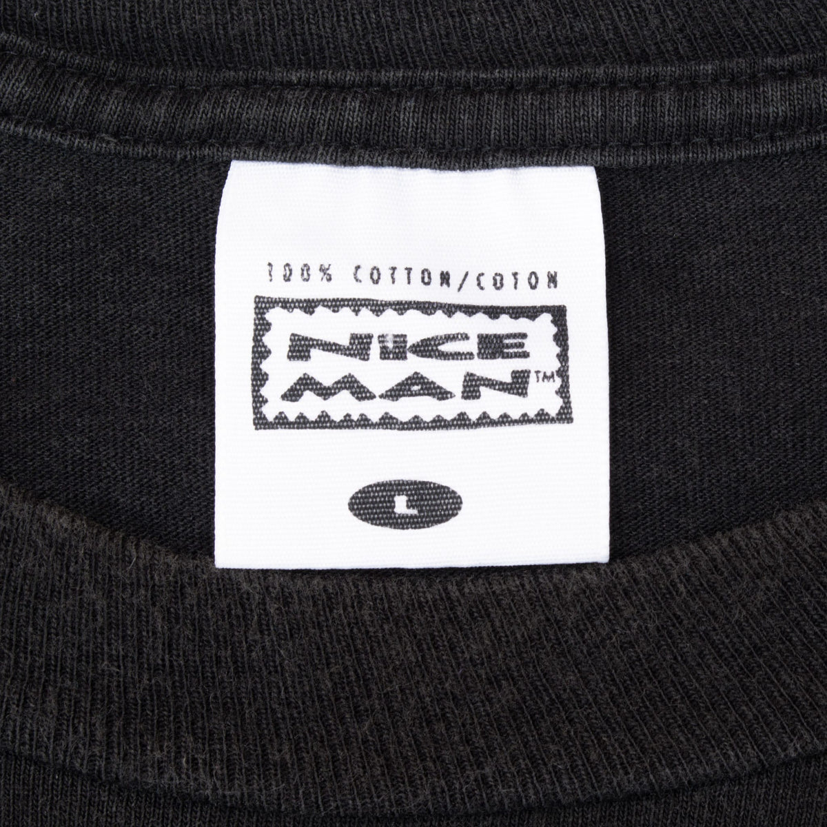 Close-up of Nice Man size L neck label marked 100% cotton