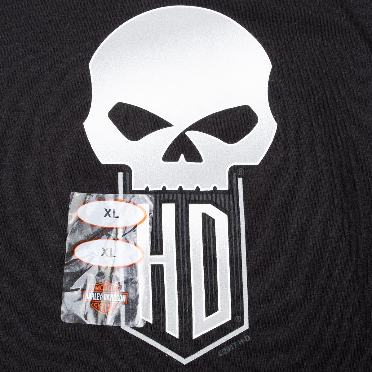Close-up of white skull and H-D chest print with XL size stickers