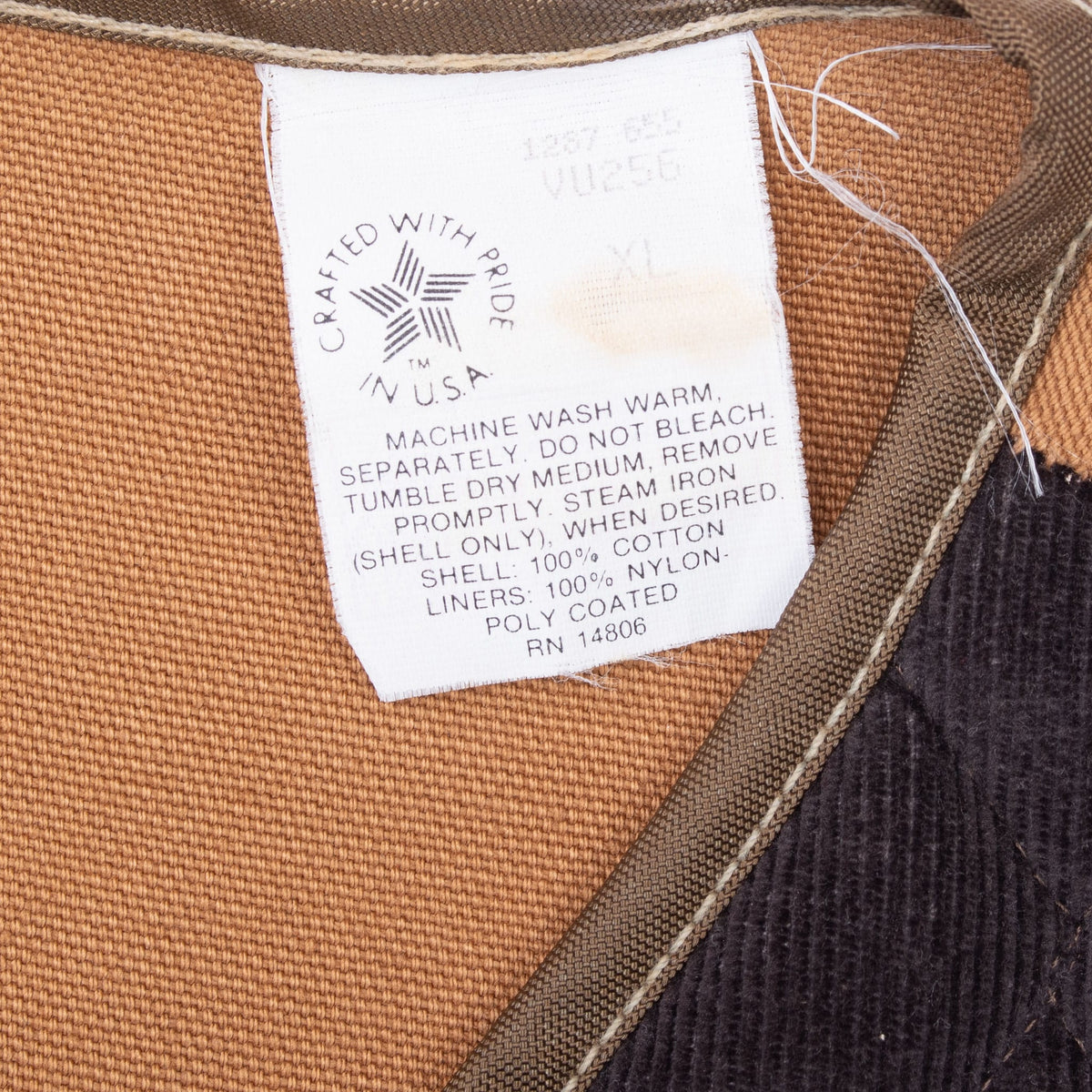 Carhartt VU256 care label with union-made USA text inside brown hunter vest